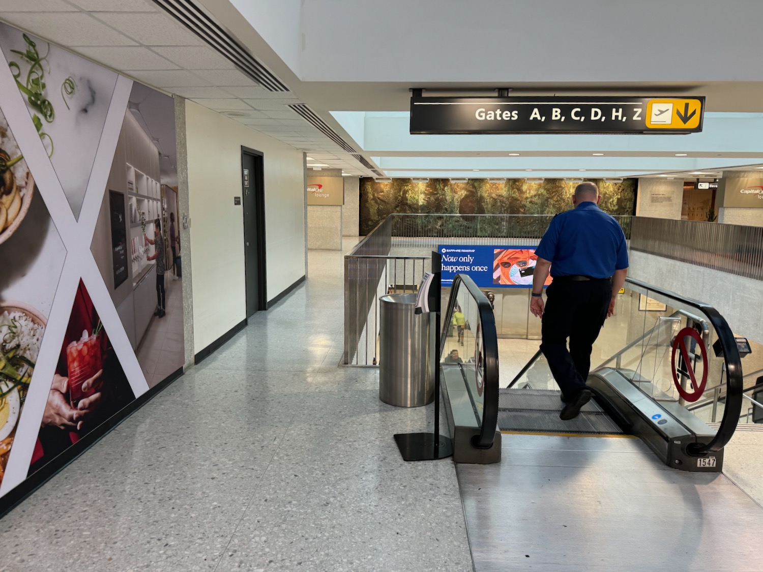 a man walking up an escalator