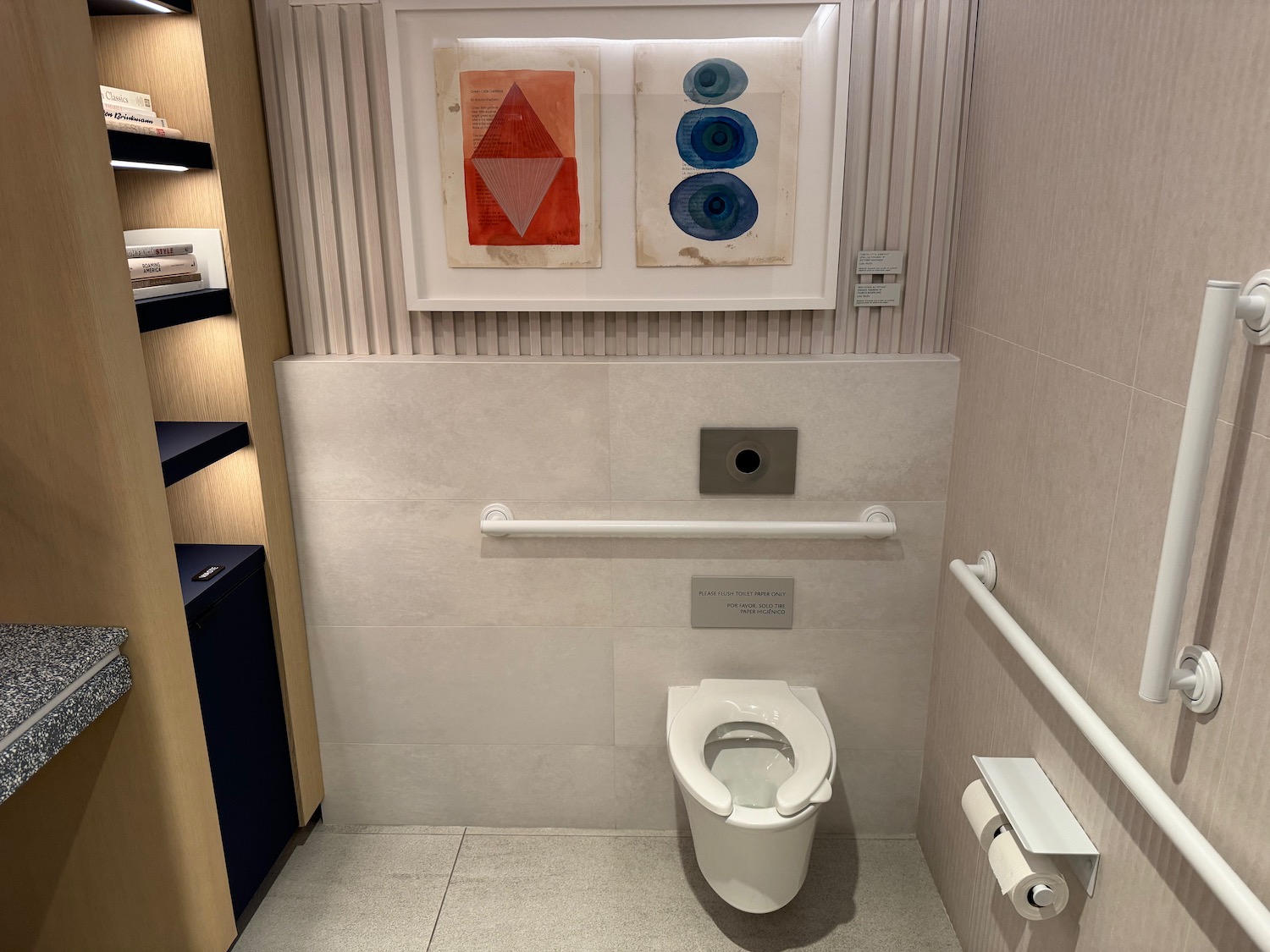 a bathroom with a toilet and a bar