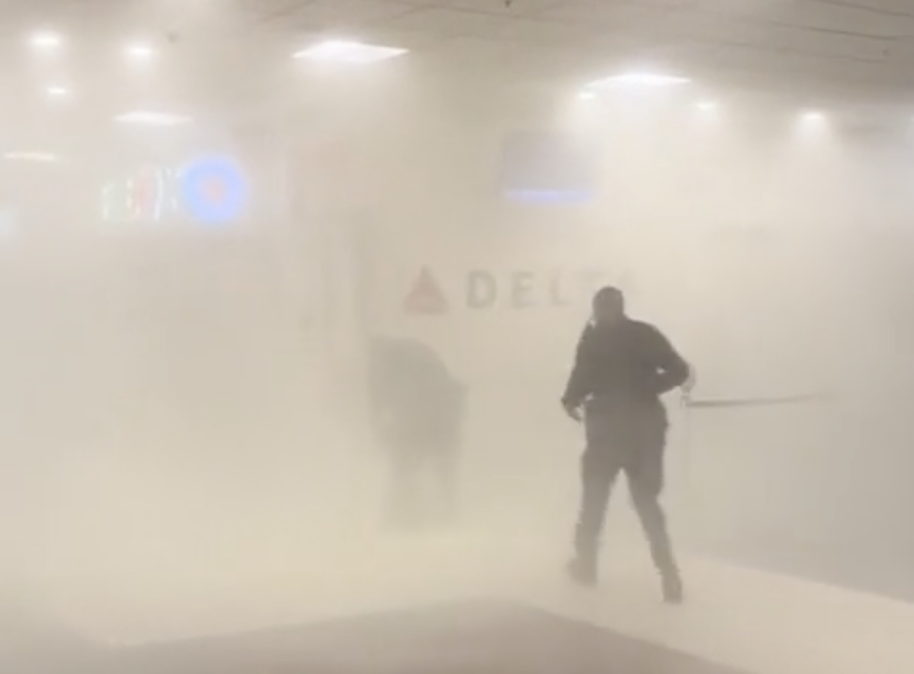 a man standing in a room with fog