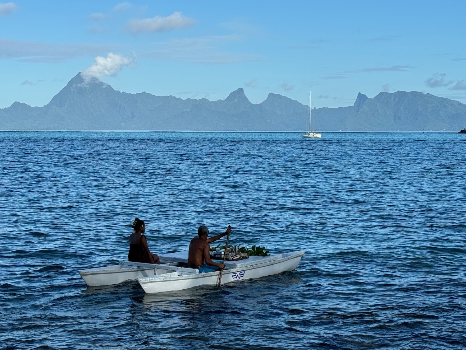 a couple in a boat on the water