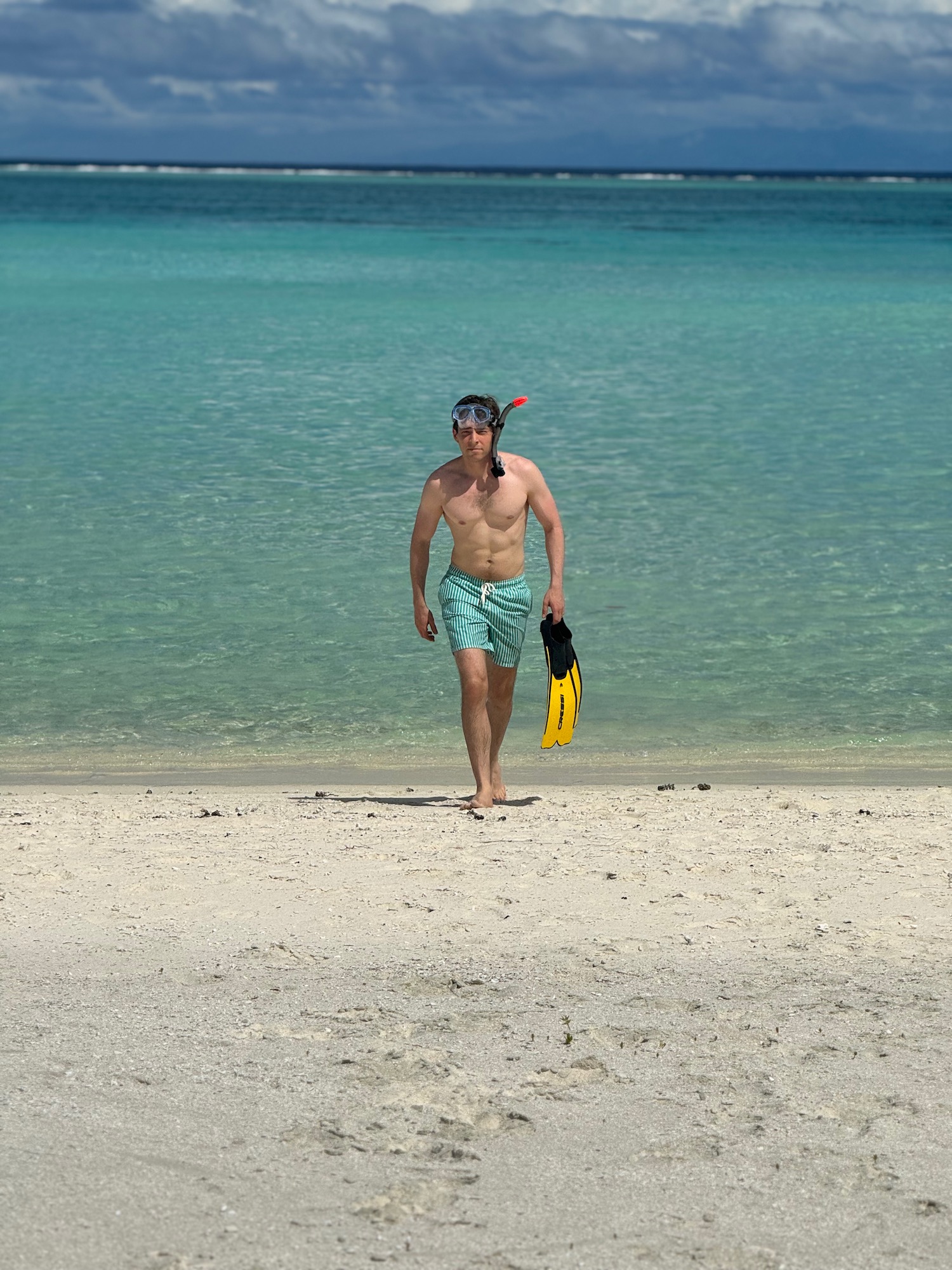 a man walking on a beach