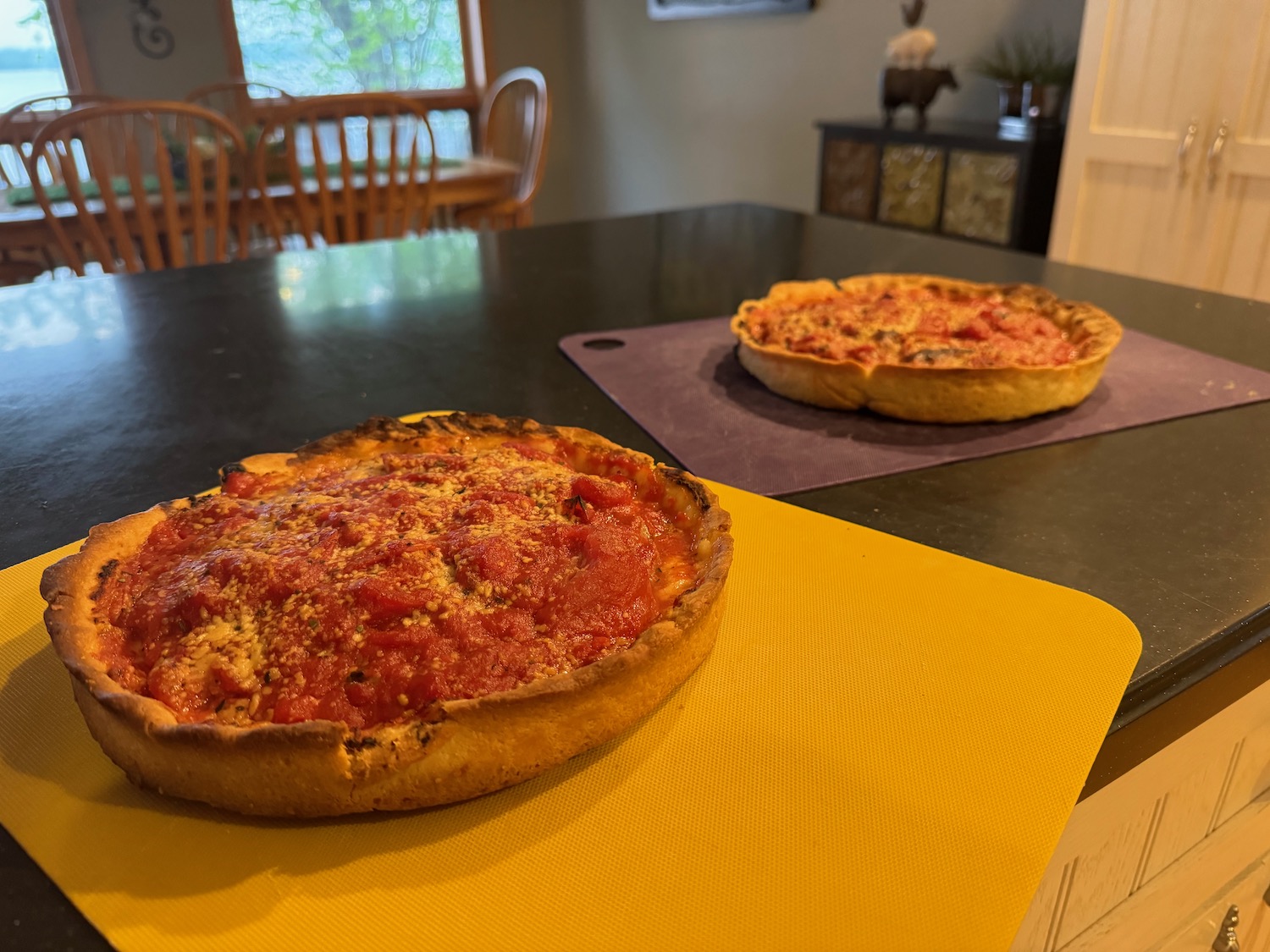 two pizzas on a table