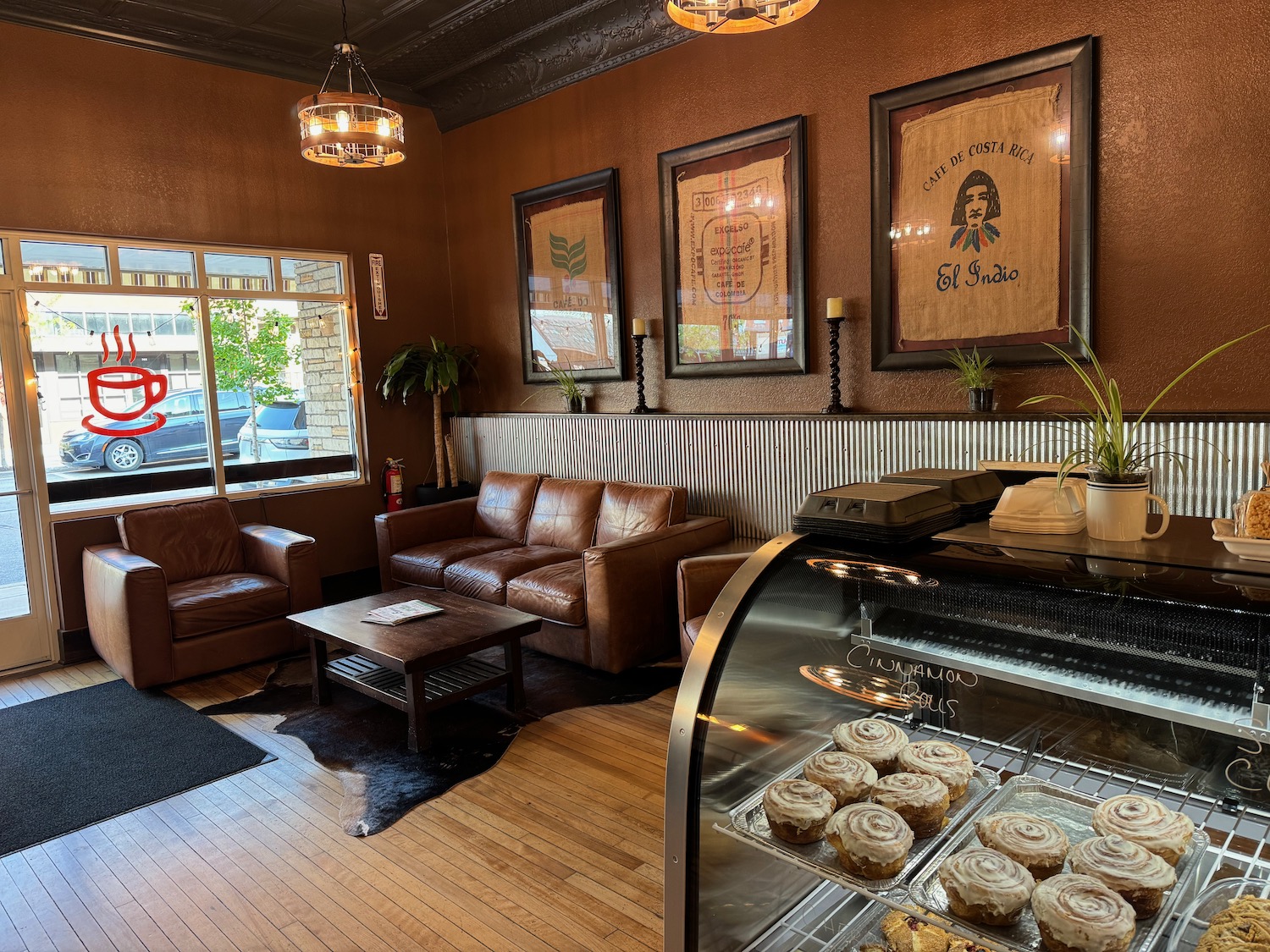 a coffee shop with couches and pastries