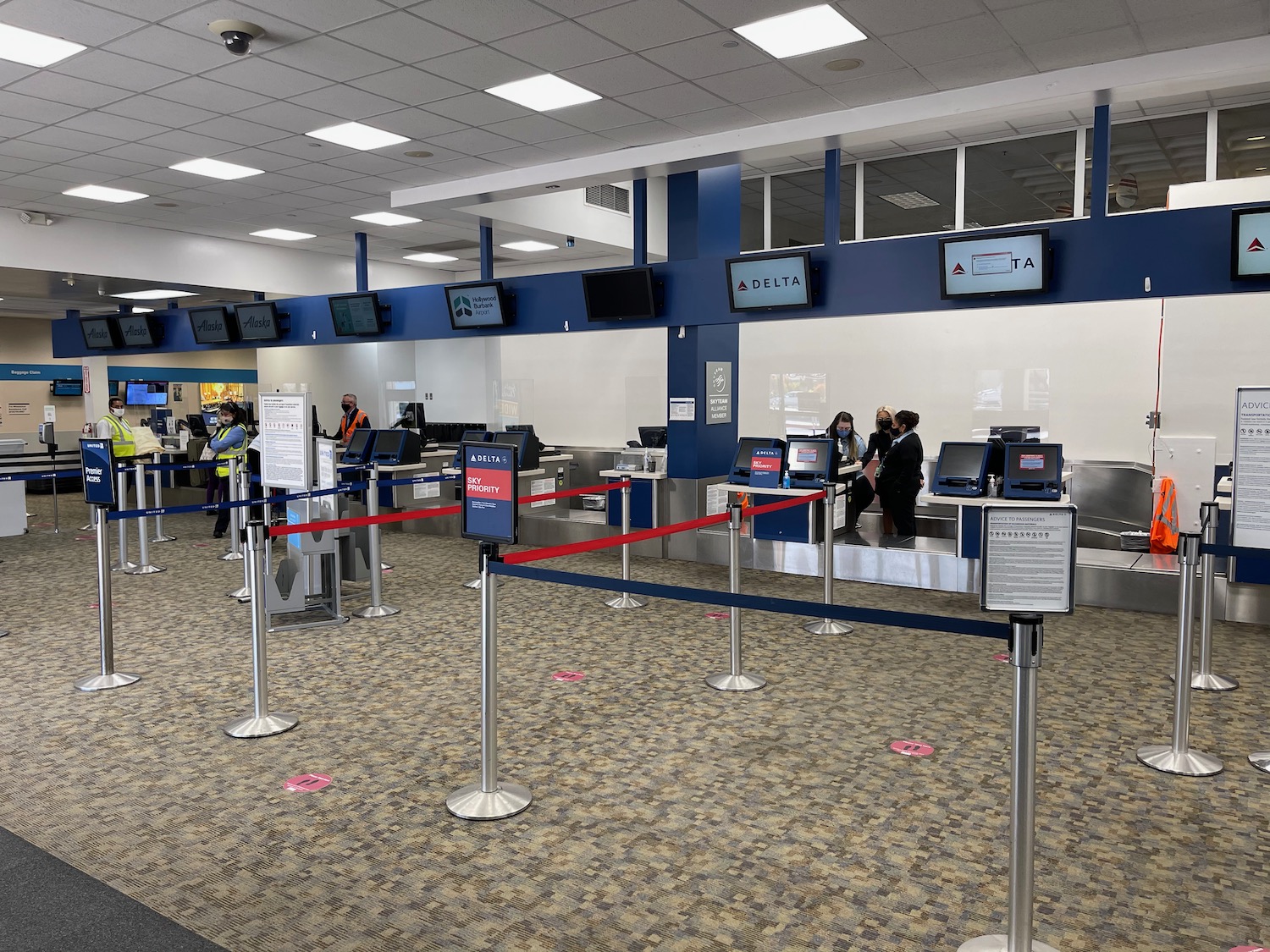 people standing in a line in a terminal