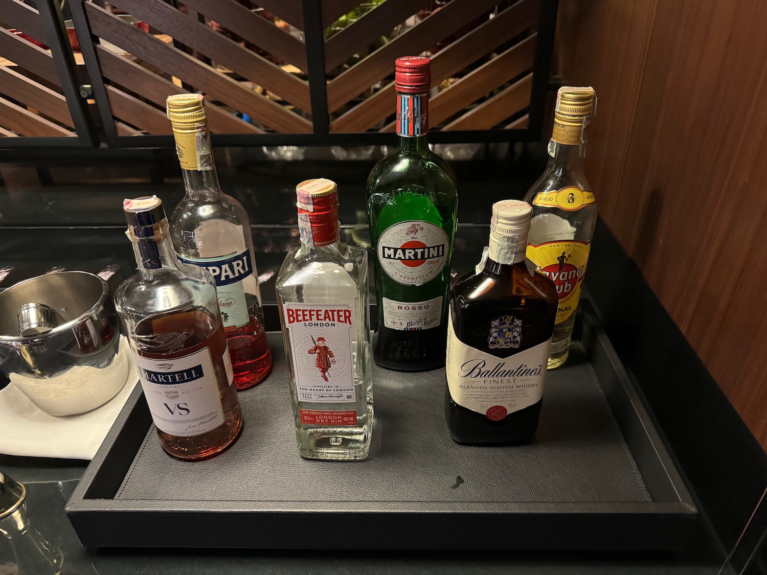 a group of bottles of alcohol on a tray