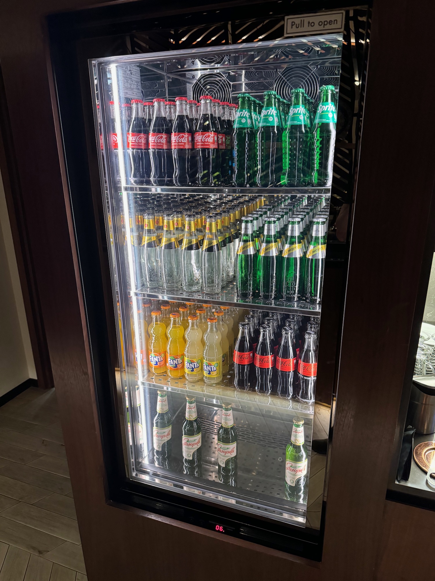 a display case of soda bottles