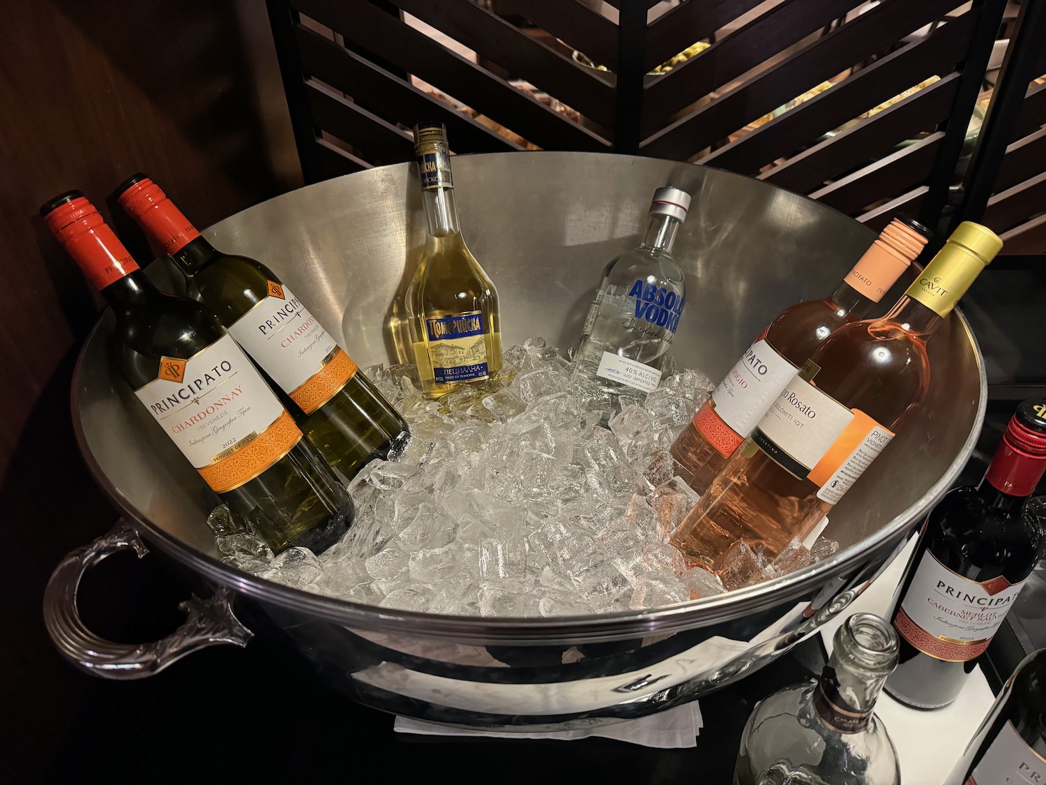 a bowl of wine bottles in ice