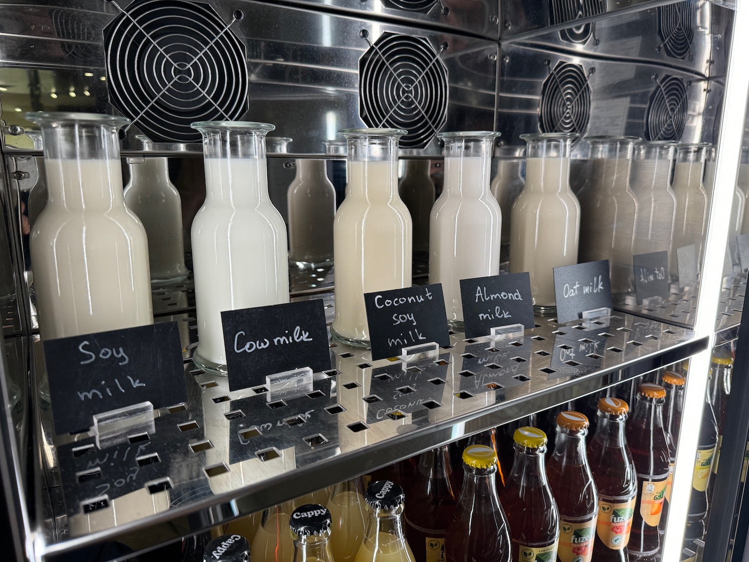 bottles of milk and other beverages on a shelf