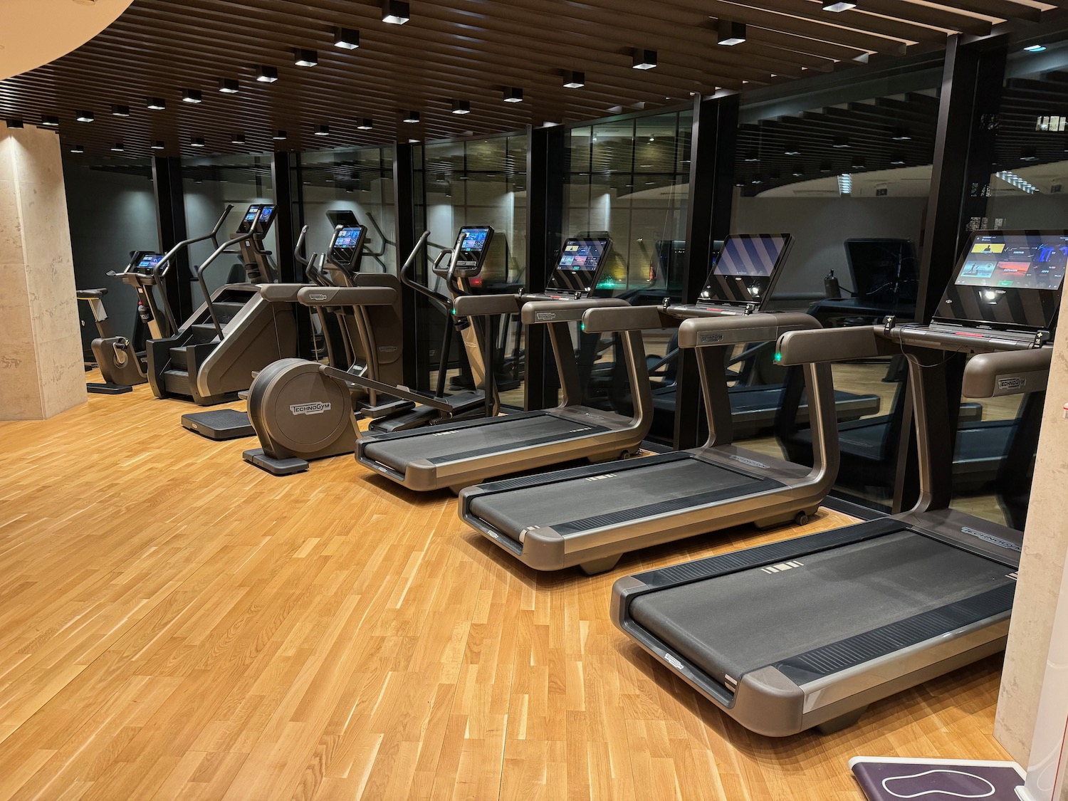 a group of treadmills in a gym