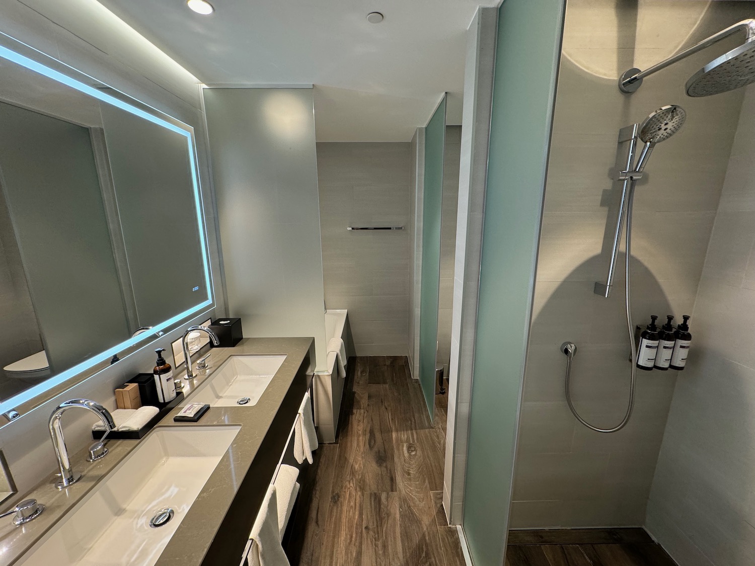 a bathroom with a shower and sinks