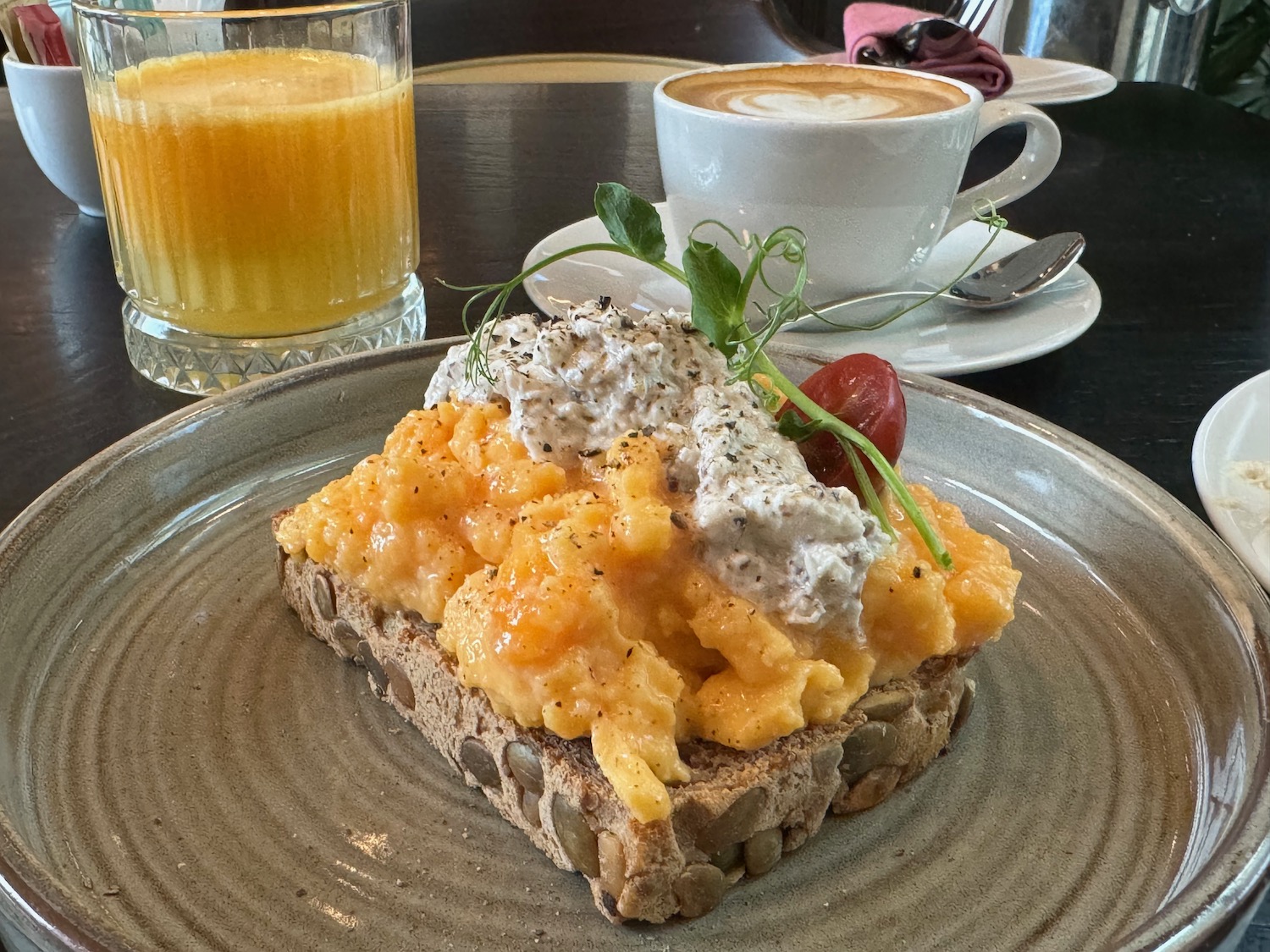 a plate of food and a cup of coffee