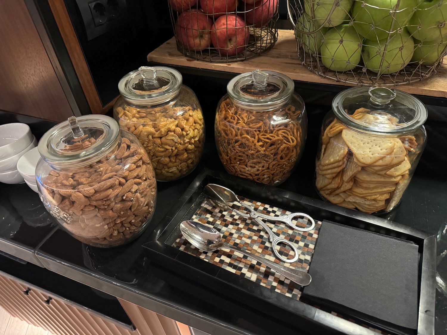 a group of glass jars with food in them