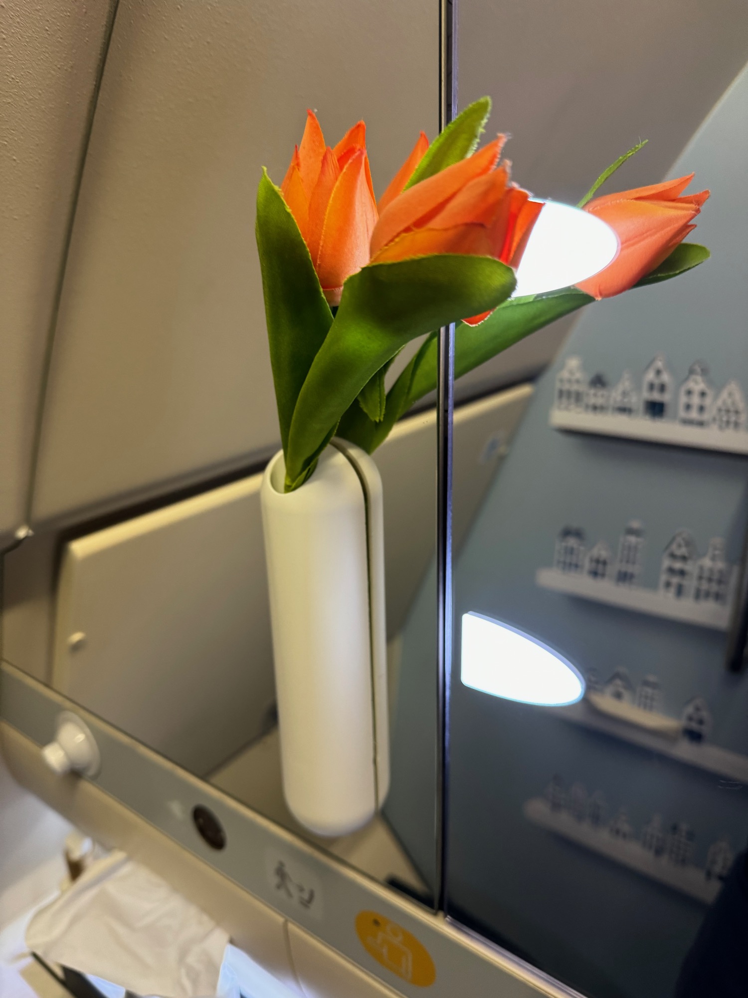 a vase with orange flowers in it