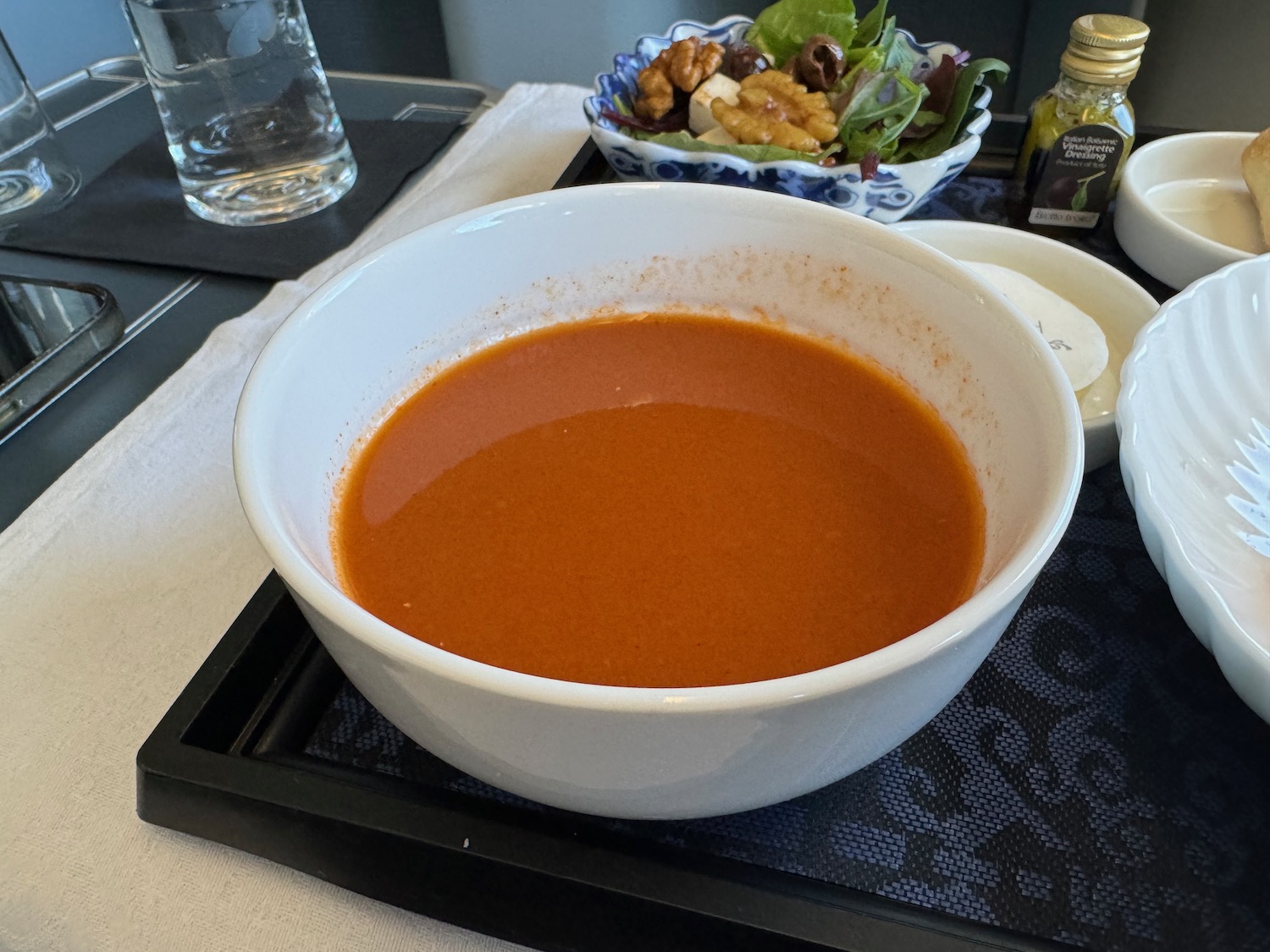 a bowl of soup on a tray