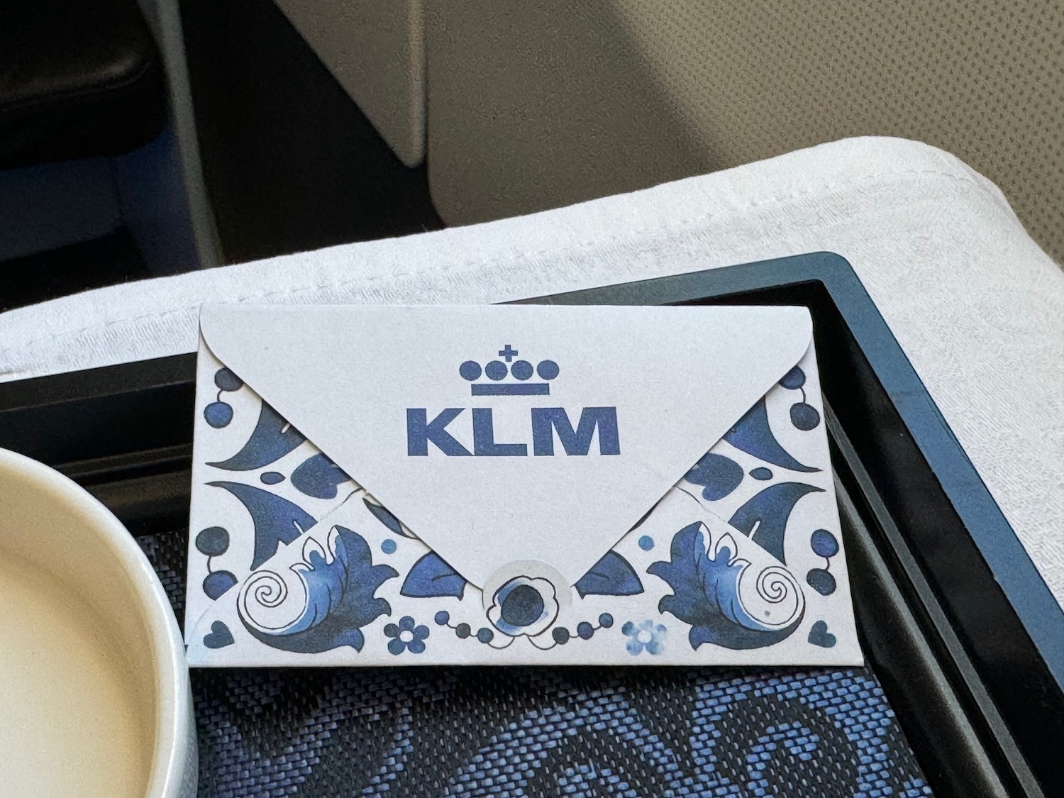 a white envelope with blue and white design on it