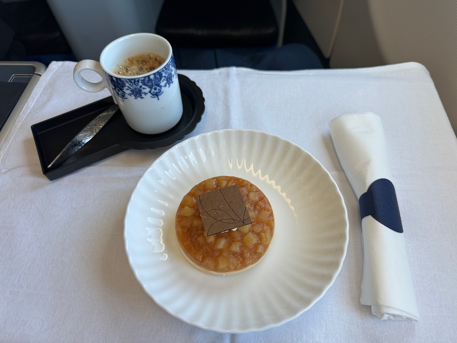 a plate of dessert and a cup of coffee