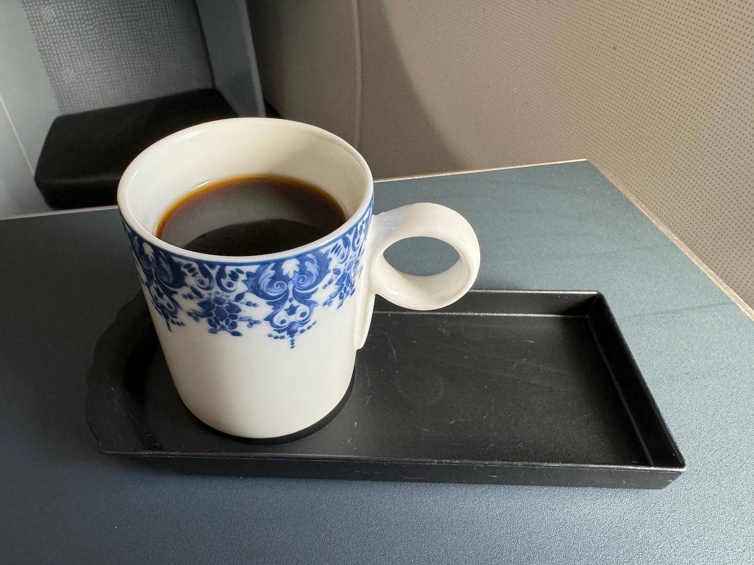 a cup of coffee on a tray