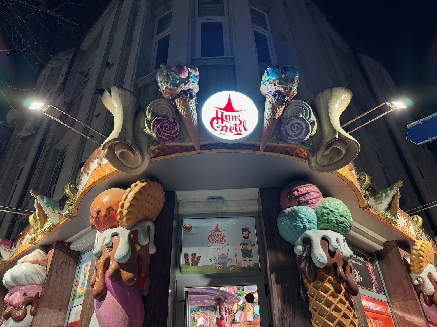 a building with ice cream cones and a sign
