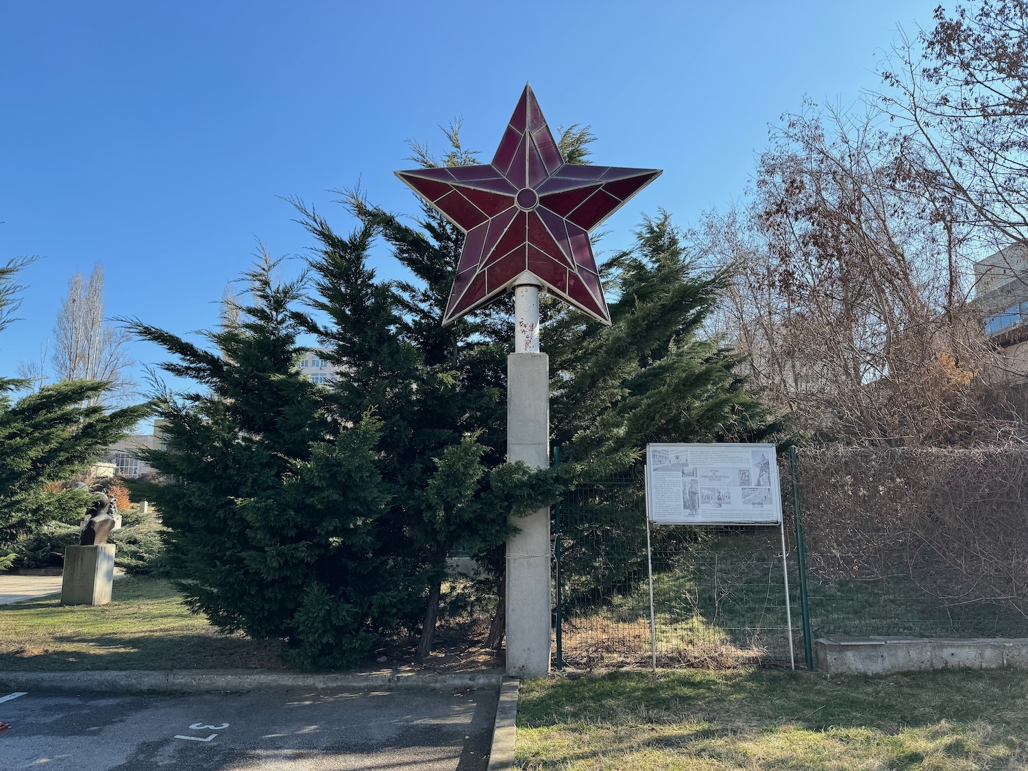 a large red star on a pole