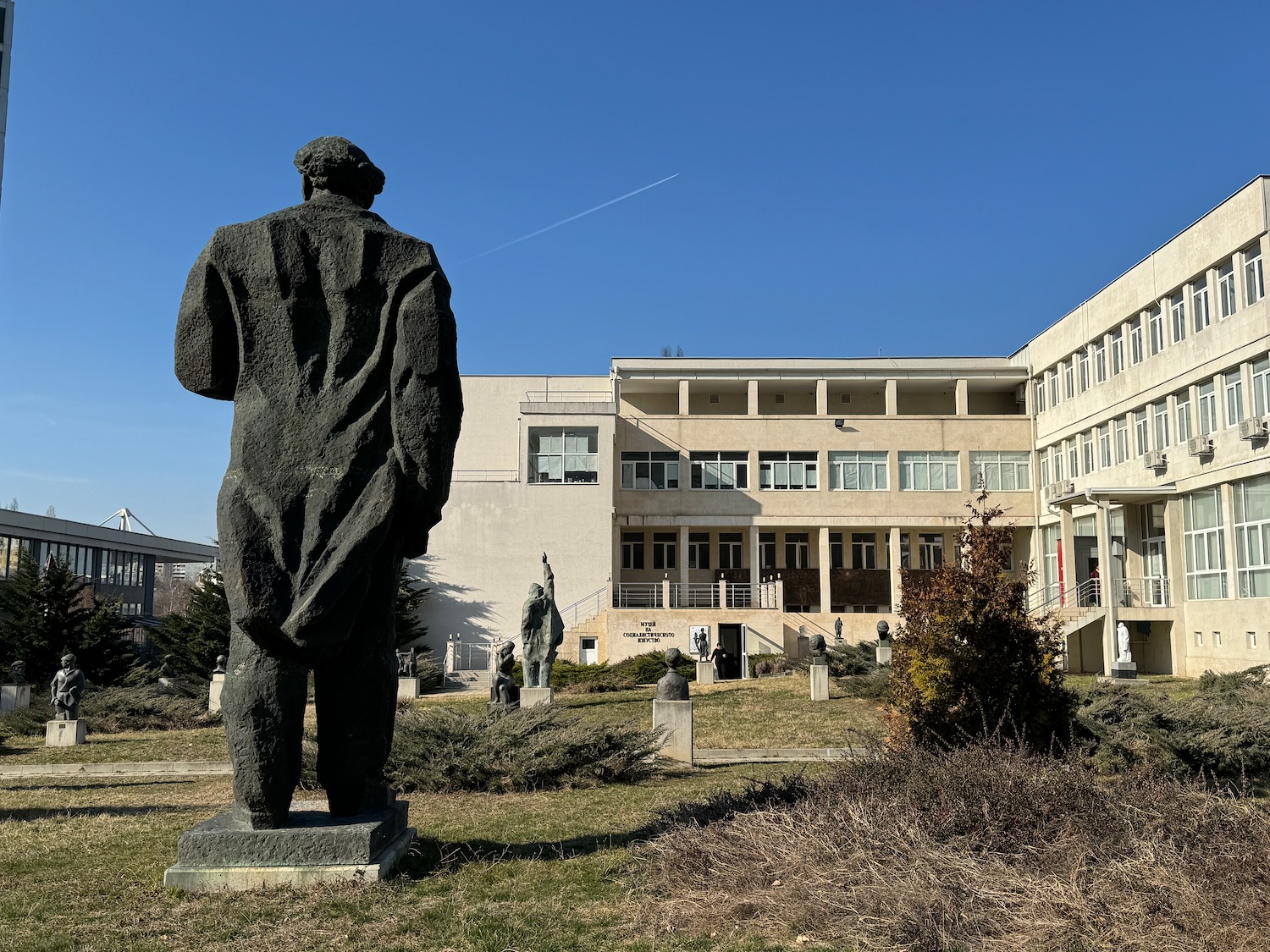 a statue of a man in front of a building