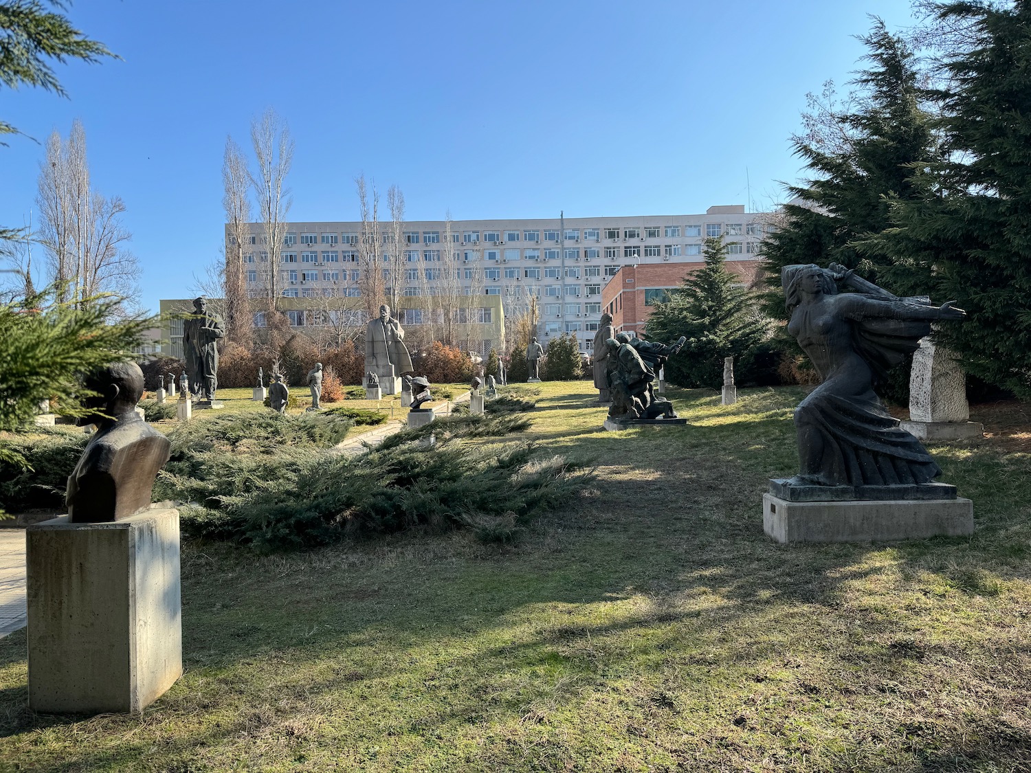 a group of statues in a park