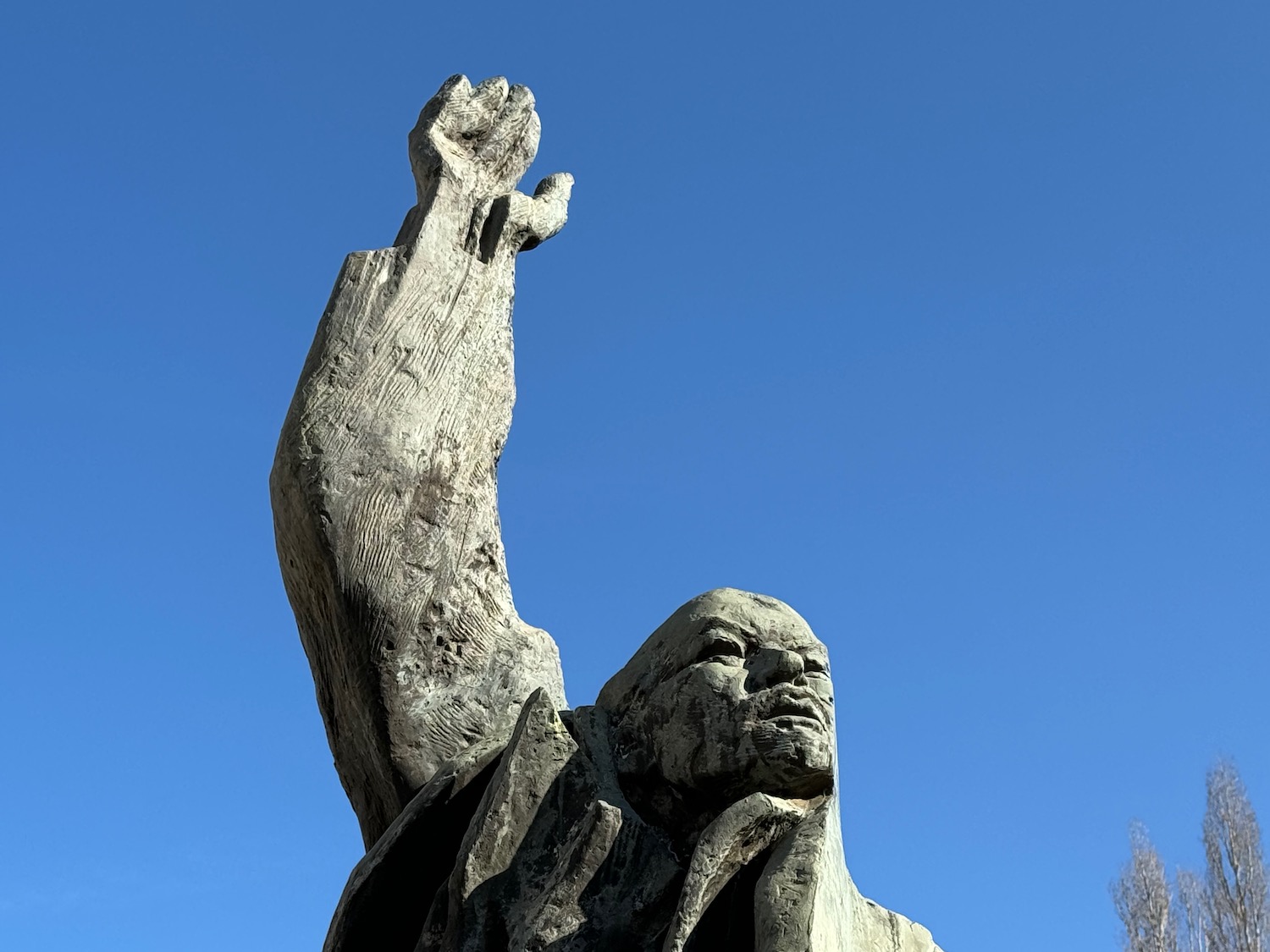 a statue of a man with a raised hand