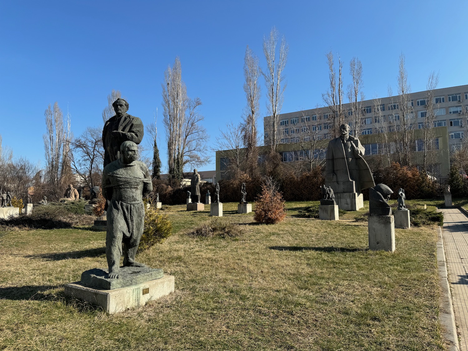 a group of statues in a park