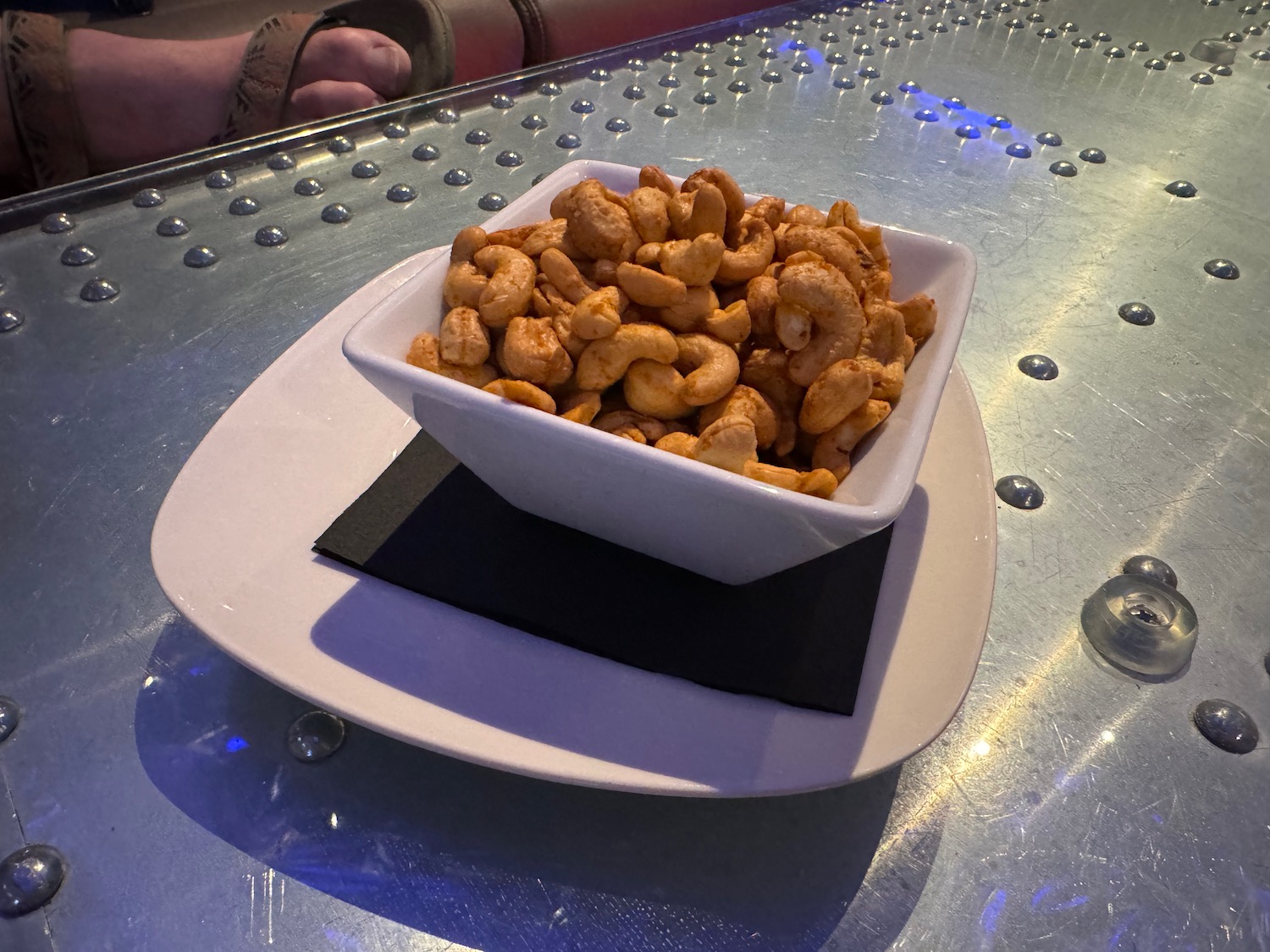 a bowl of cashew nuts on a plate