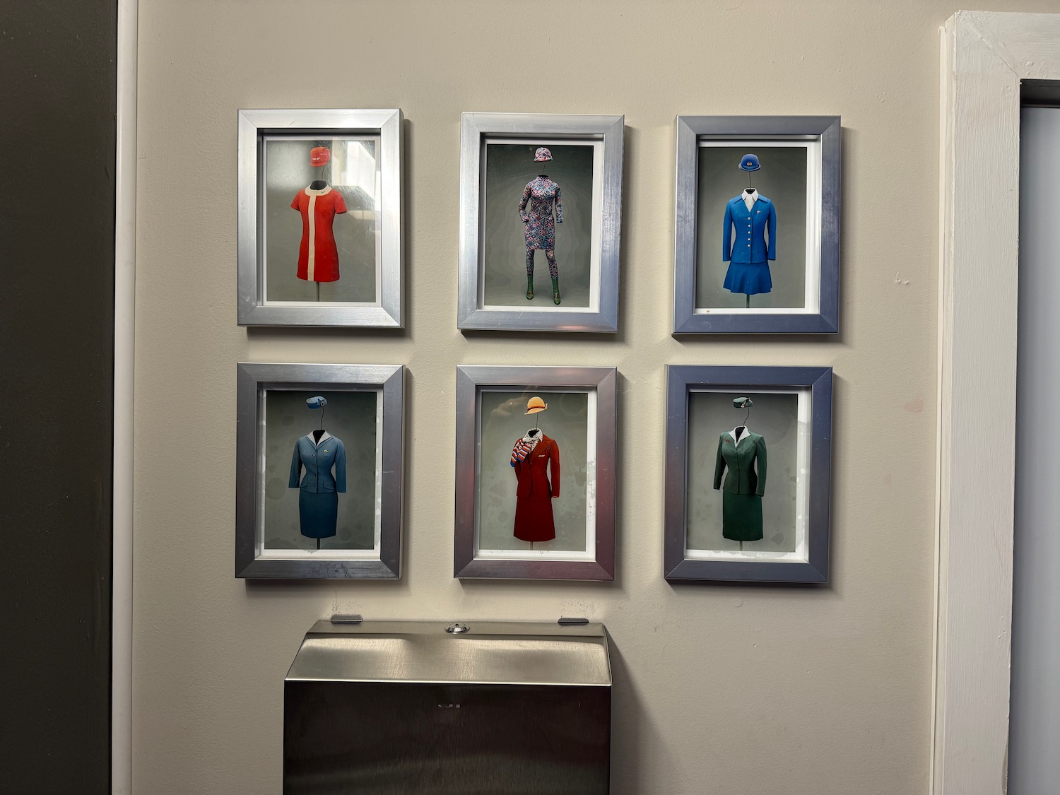 a group of framed clothing on a wall