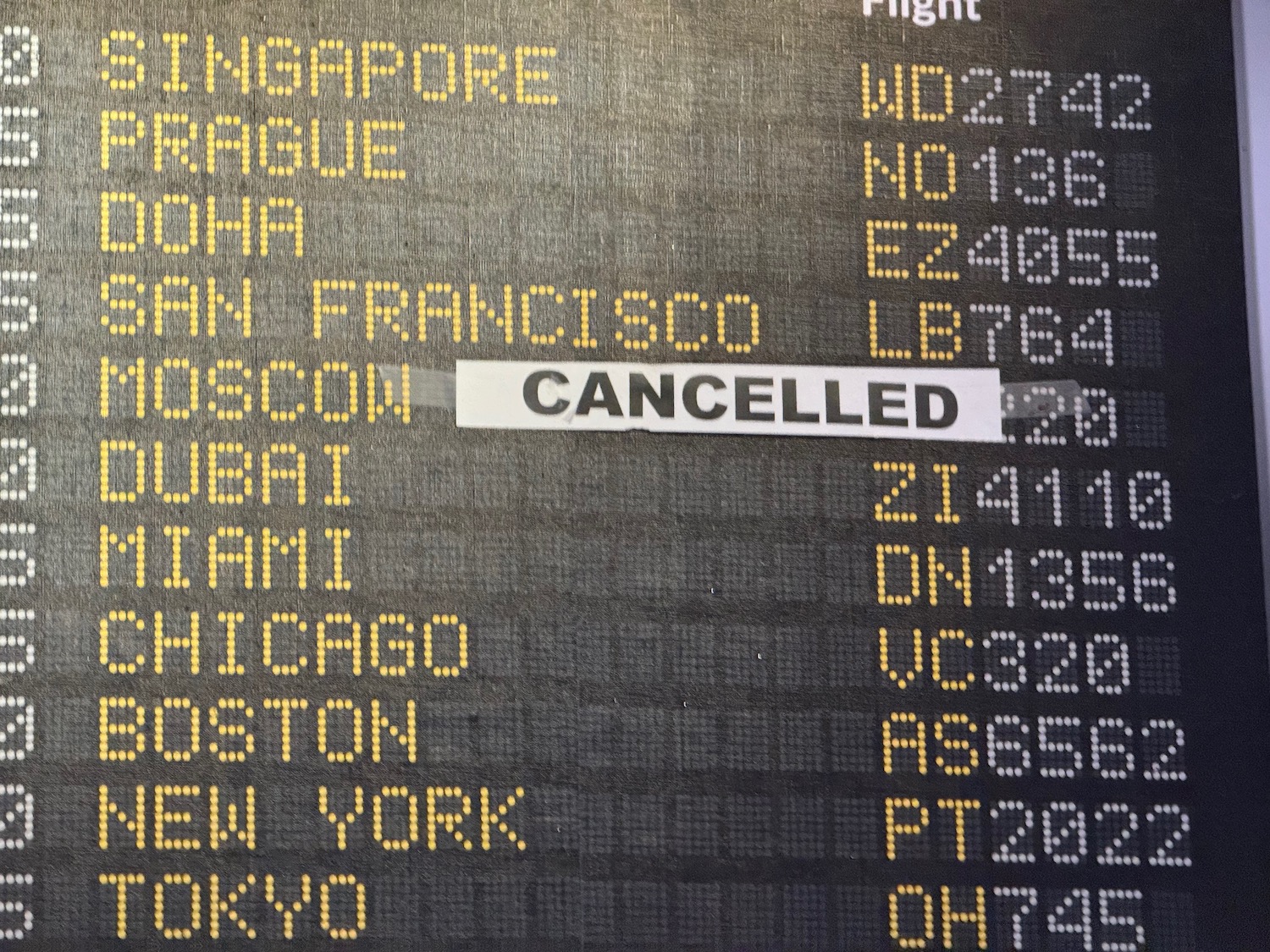 a flight schedule on a black background