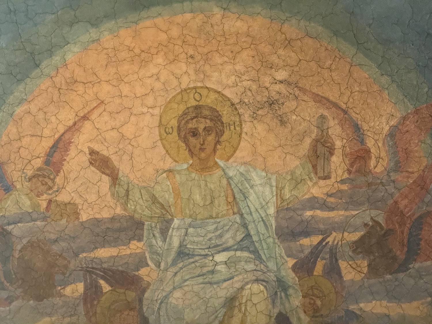 a painting of a person with wings and a circle on the top