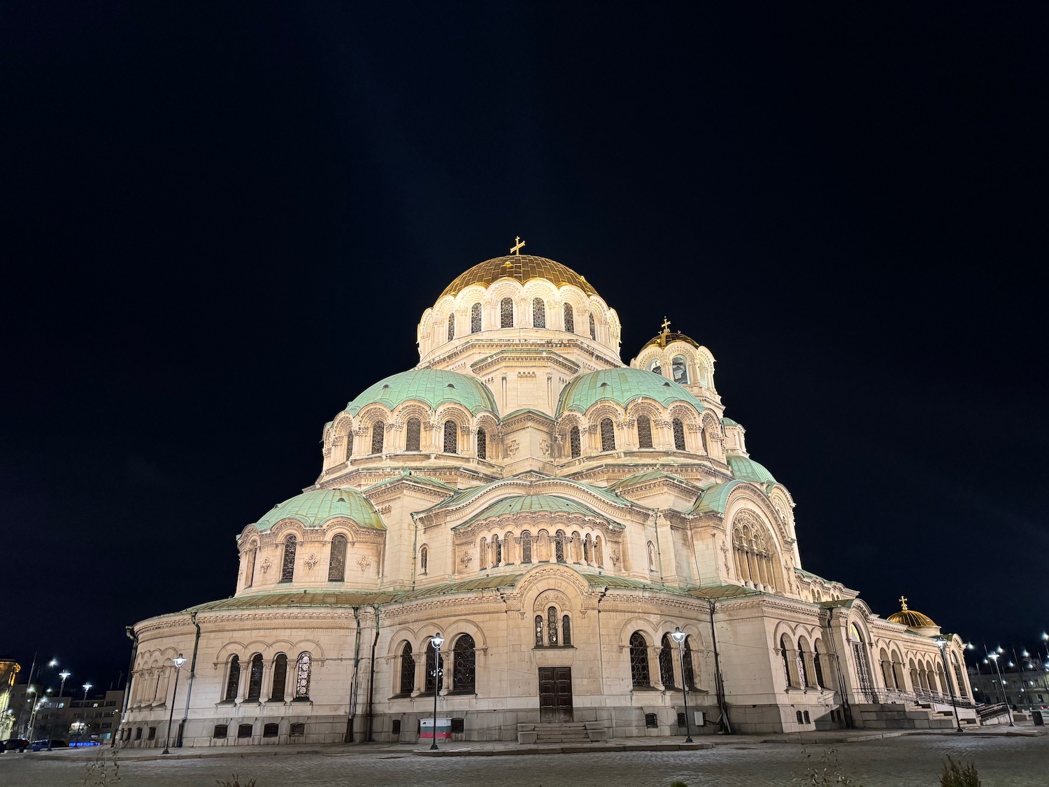 a large building with a gold and blue roof