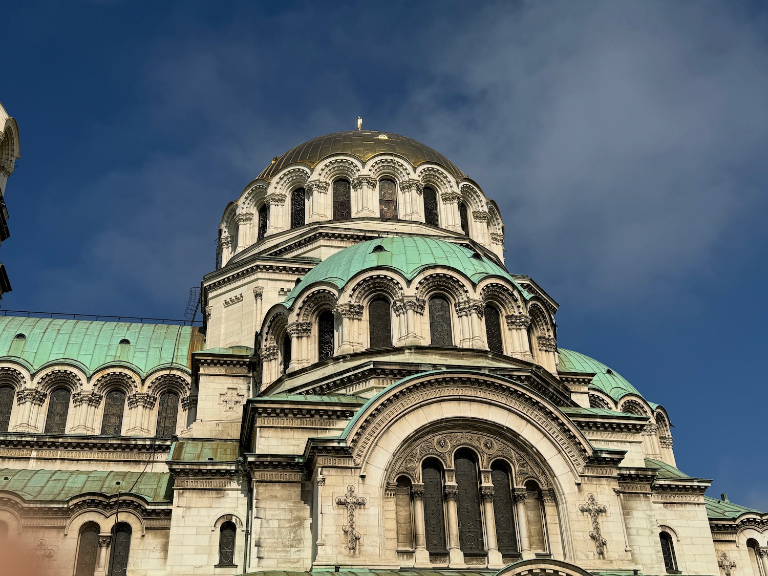 a large building with a dome with Kronstadt in the background