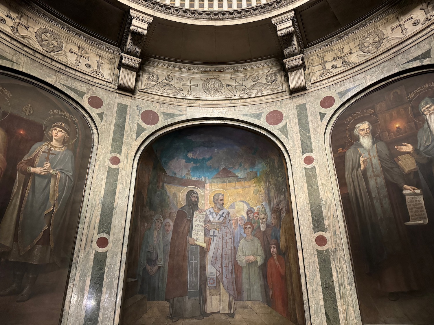 a mural of a group of people in a building