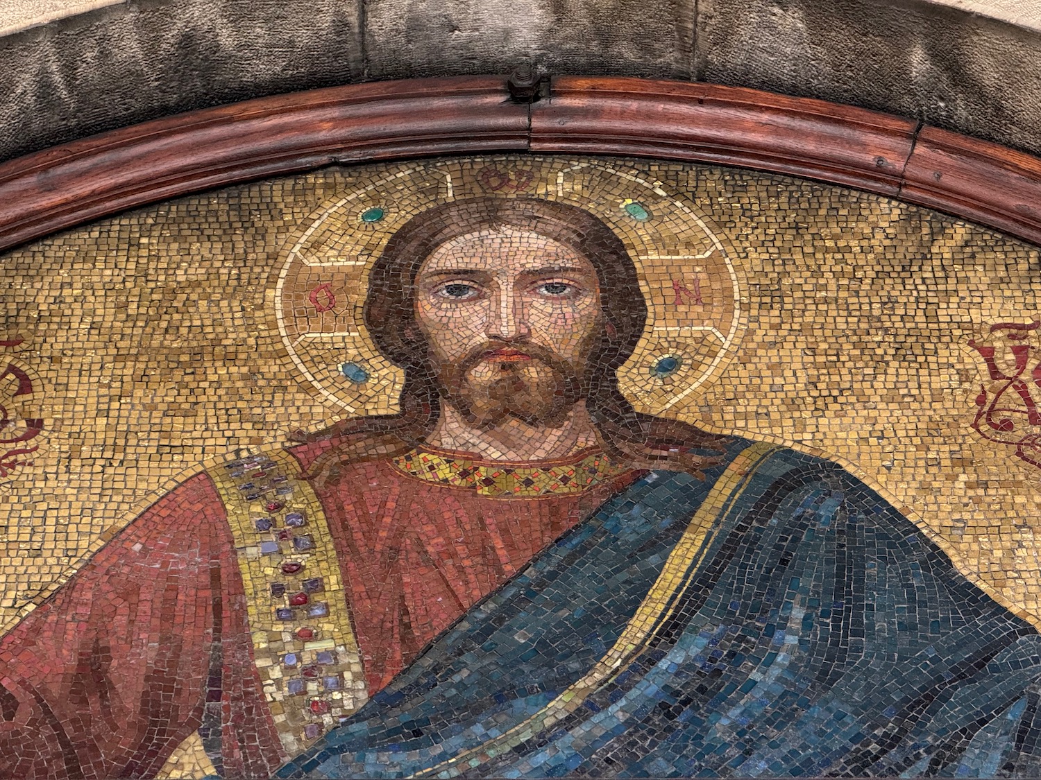 a mosaic of a man in a robe