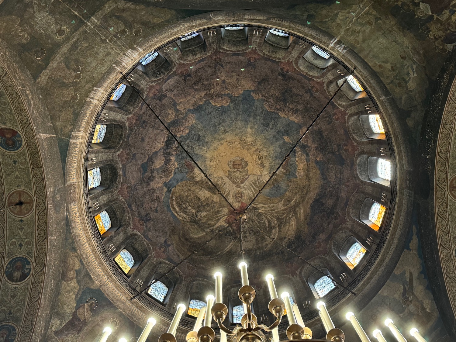 a ceiling with a painting on the ceiling