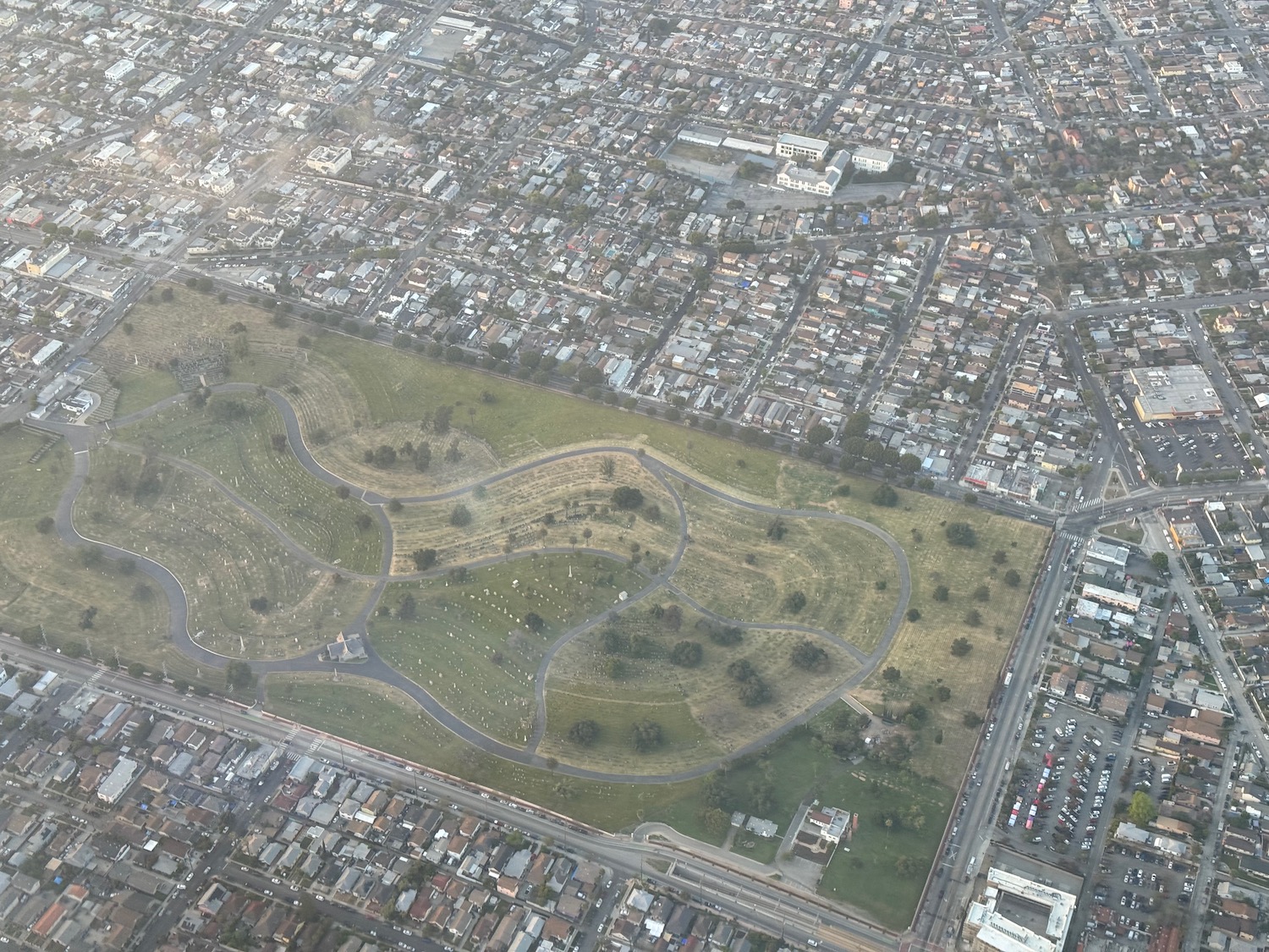 an aerial view of a park and a city