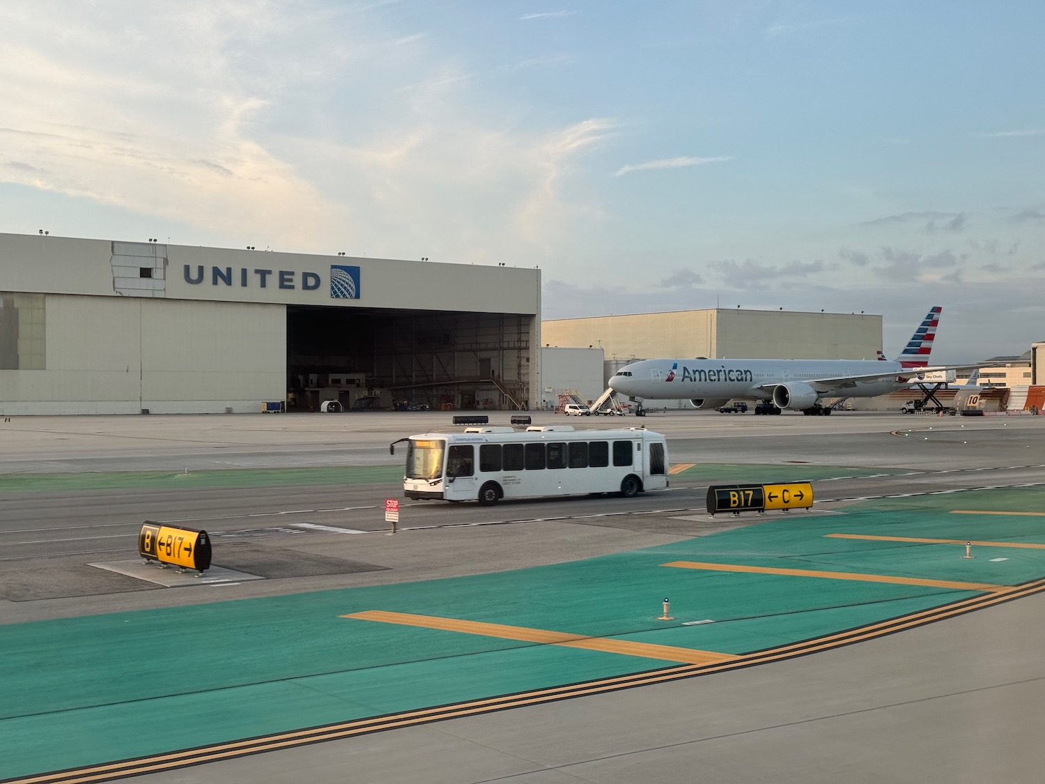 a bus and airplane in a terminal