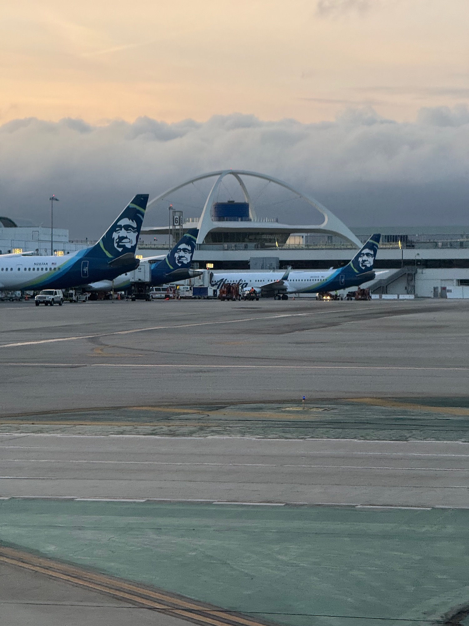 a group of airplanes on a runway