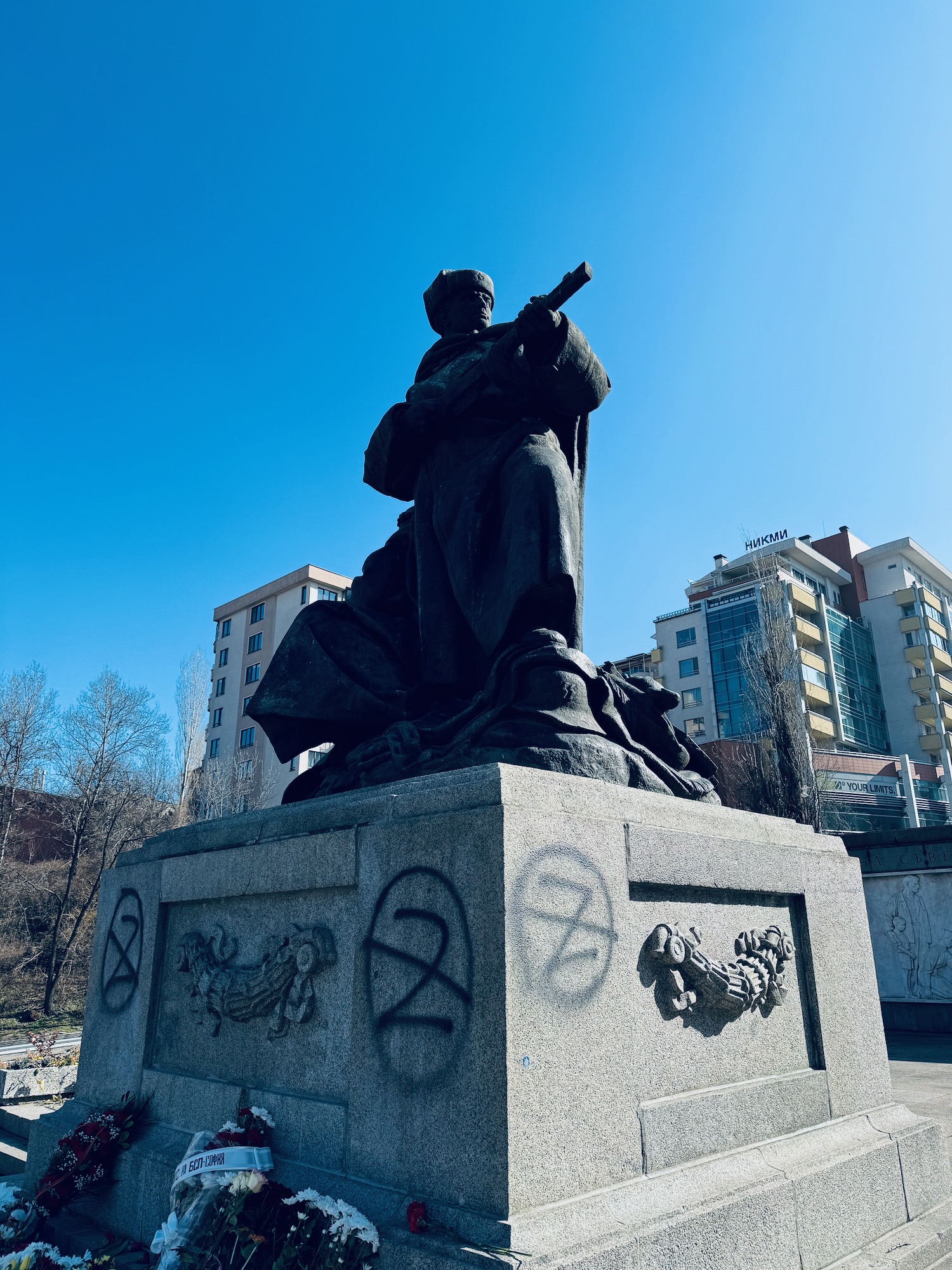 a statue of a man holding a gun