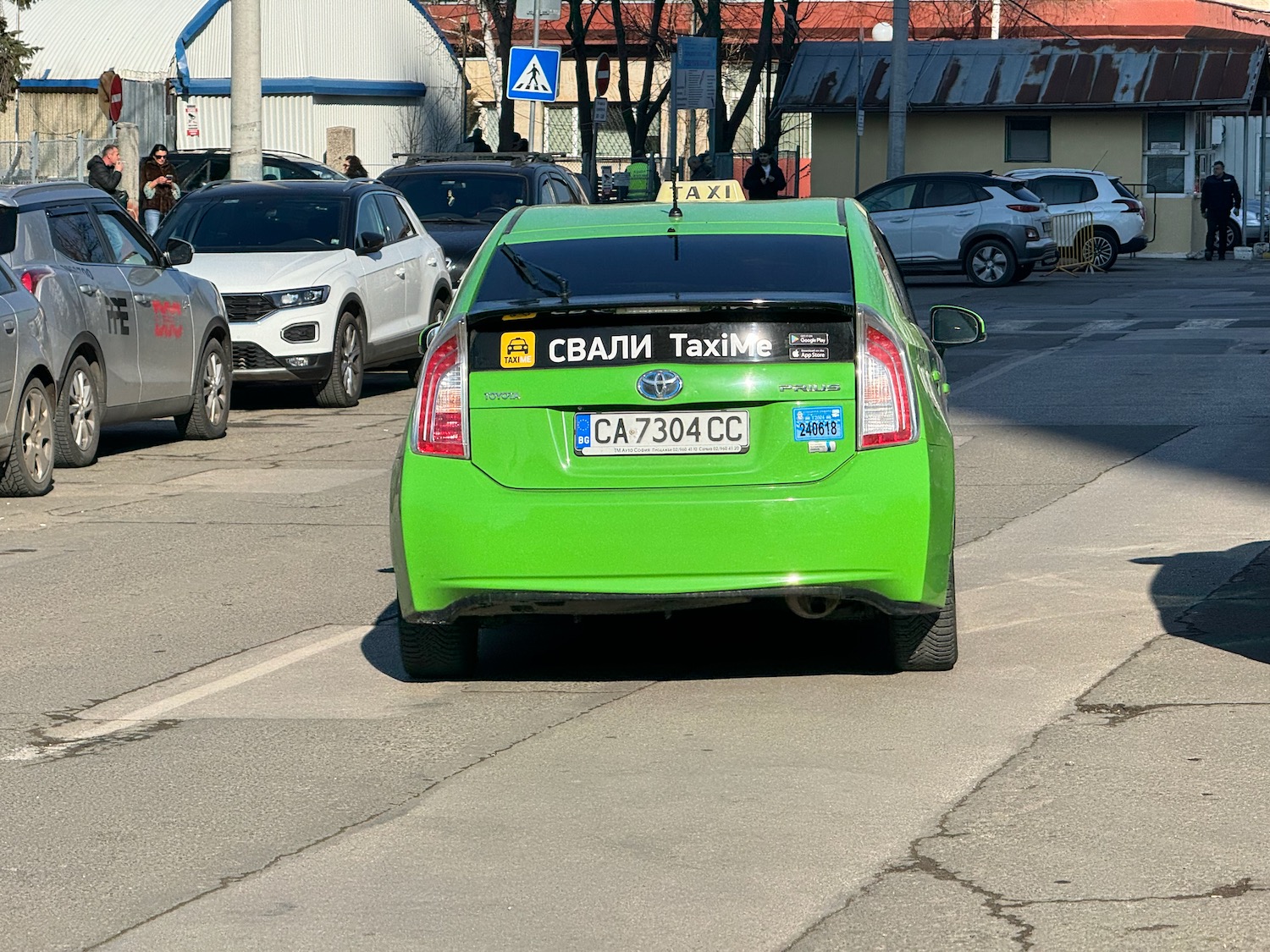 a green car on the road