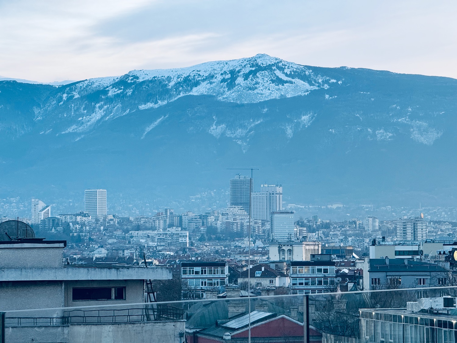 a city with a mountain in the background