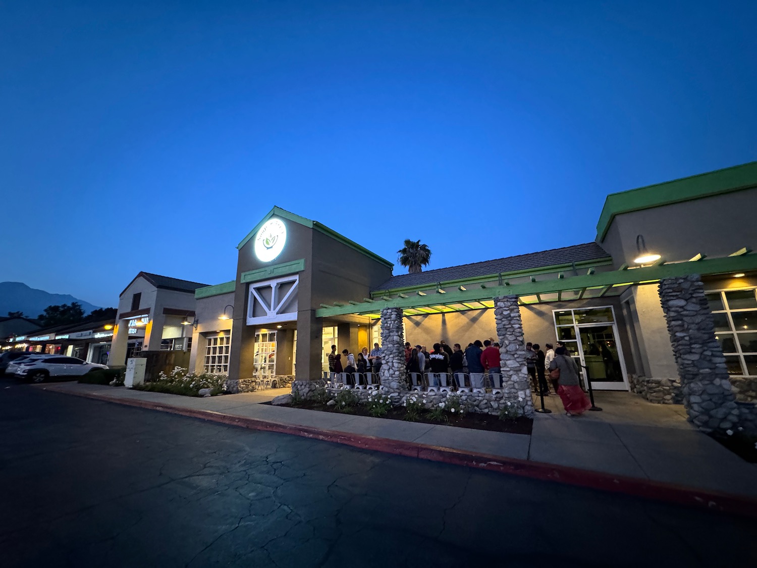 a group of people standing outside of a building