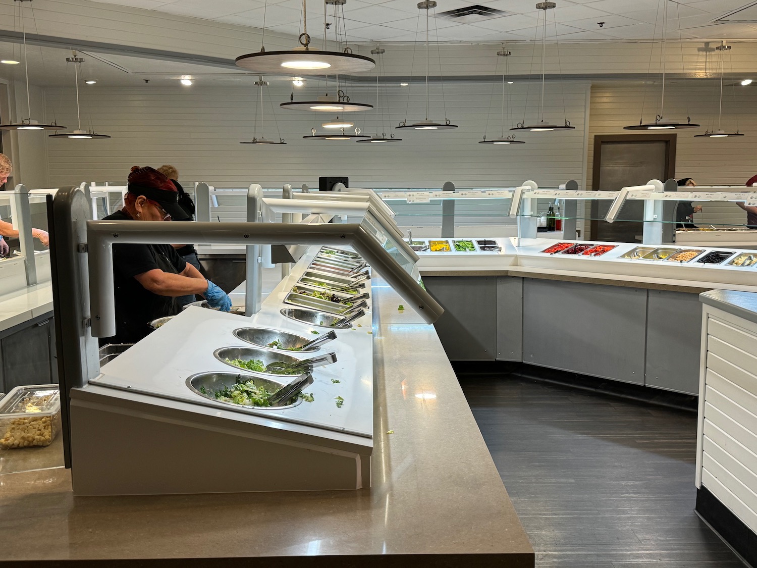 a food counter with people in it