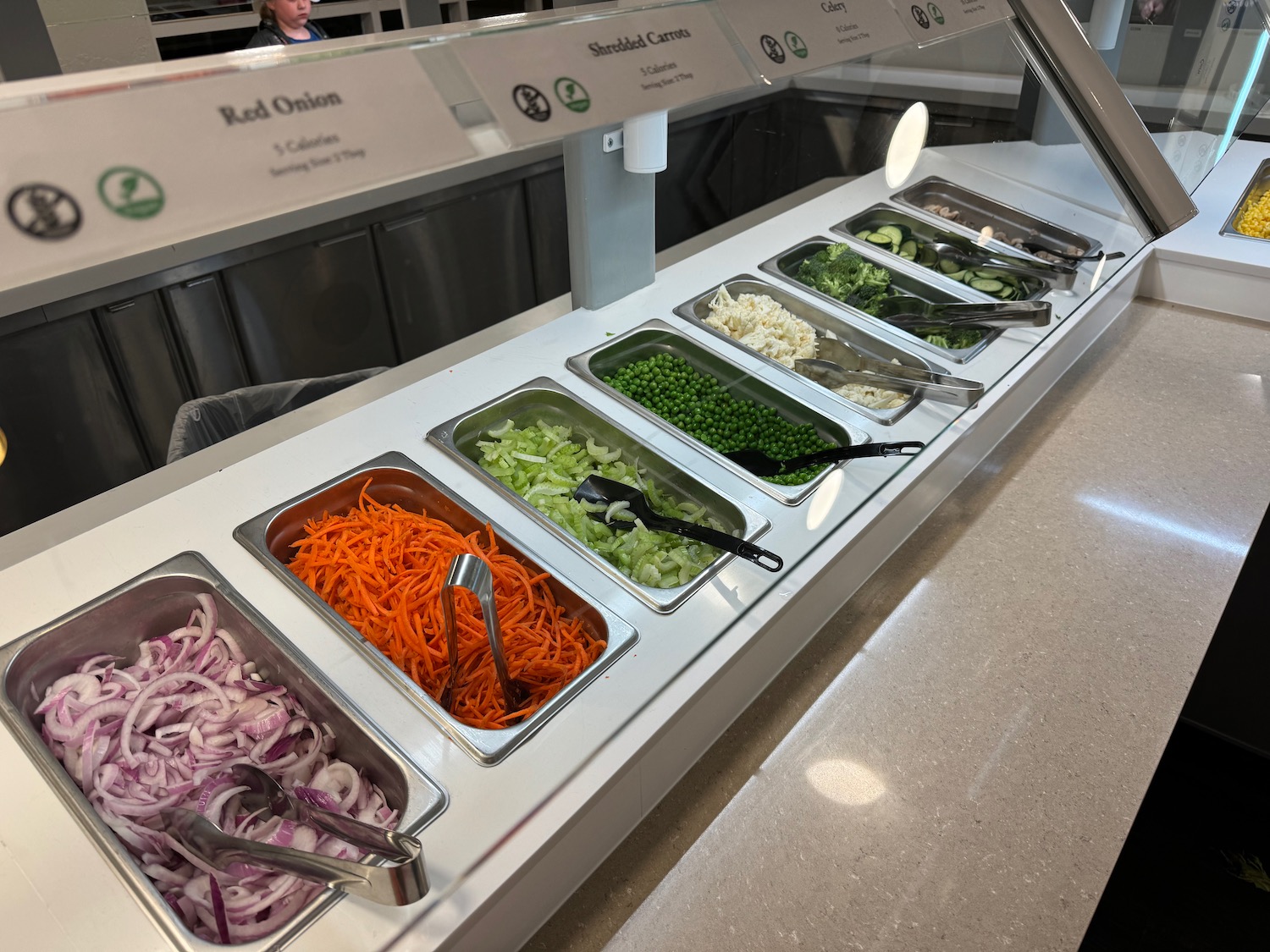 a salad bar with different types of vegetables