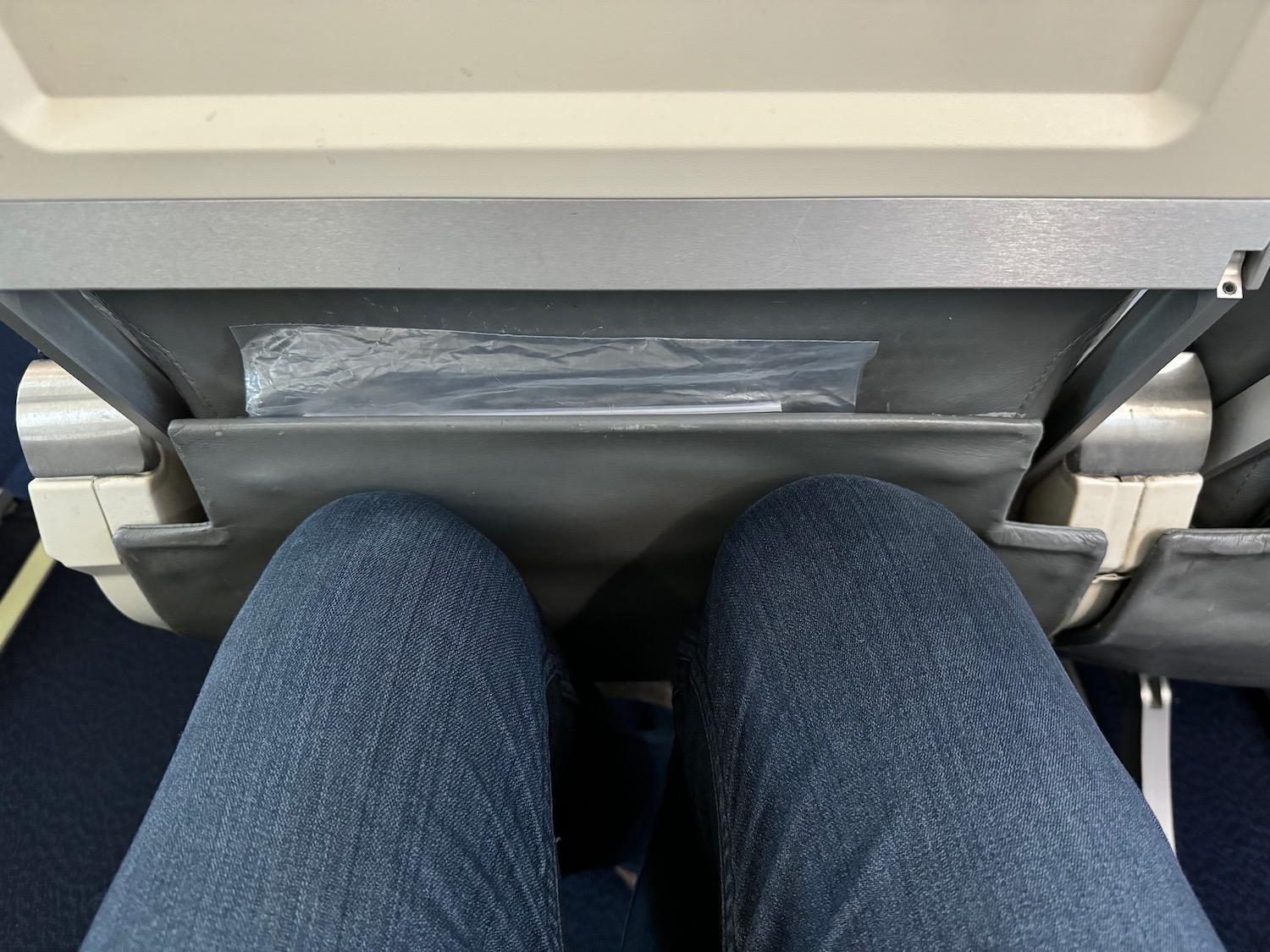 a person's legs in a seat