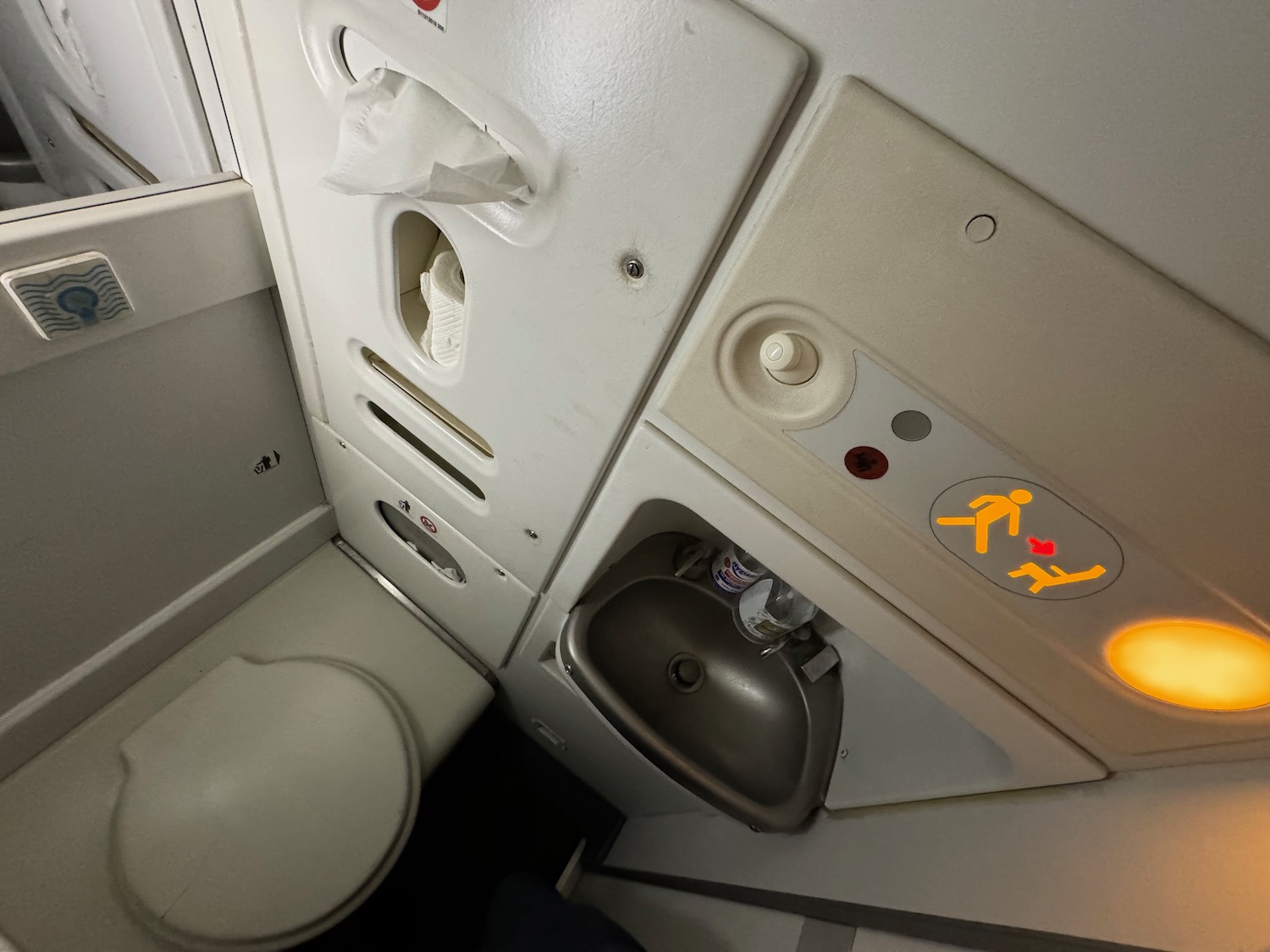 a toilet and sink in a plane