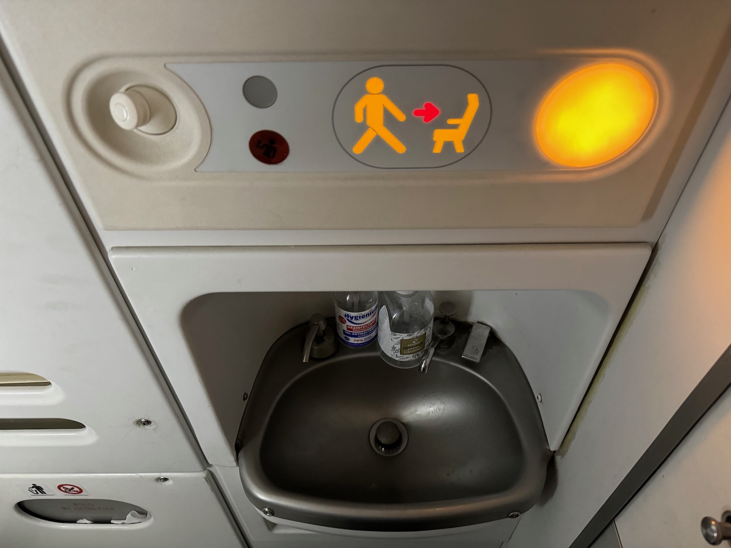 a sink and a sign on a plane