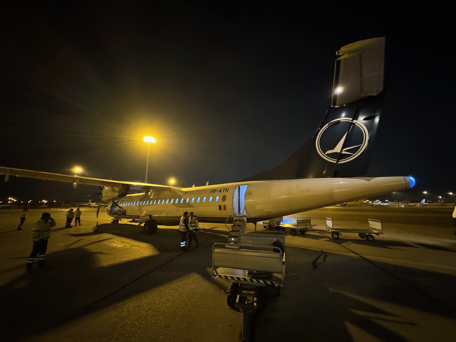 a plane on the runway at night