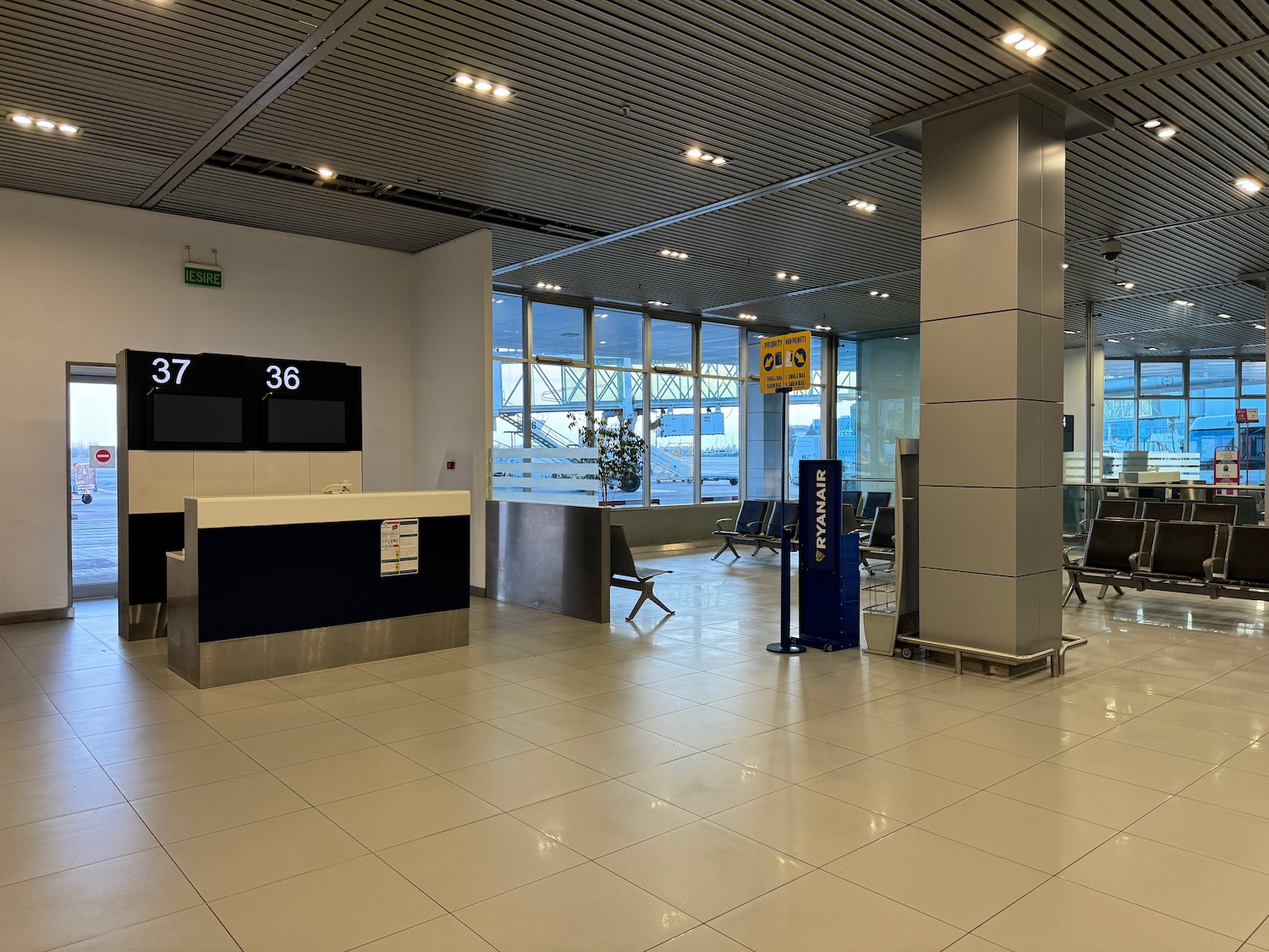 a large airport lobby with a large window